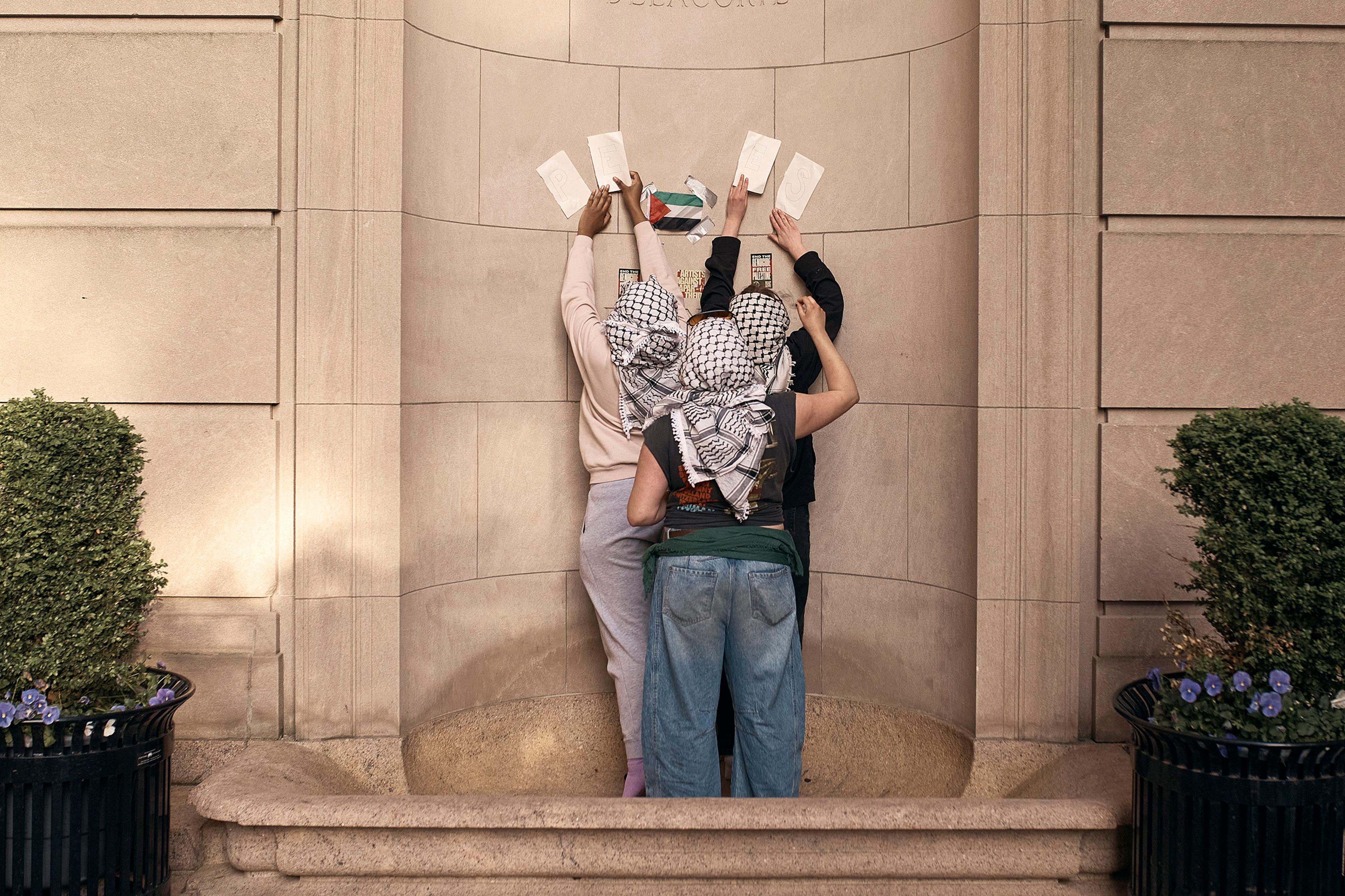 Protestors prepare during a pro-Palestinian encampment at the Columbia University in New York City, on April 30, 2024.