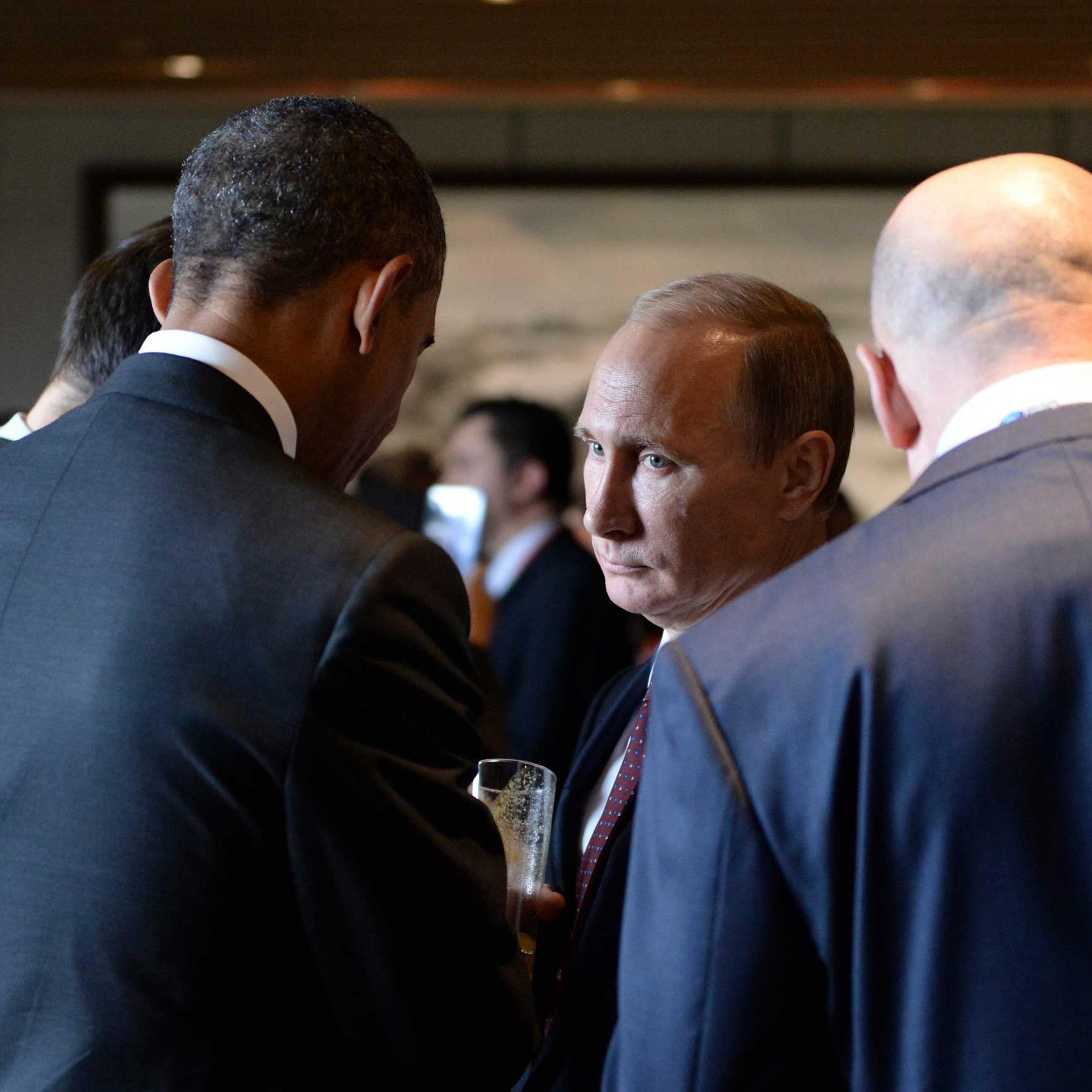 Russian President Vladimir Putin seen talking to President Barack Obama during the Asia Pacific Economic Cooperation Summit in Beijing, Nov. 11, 2014.