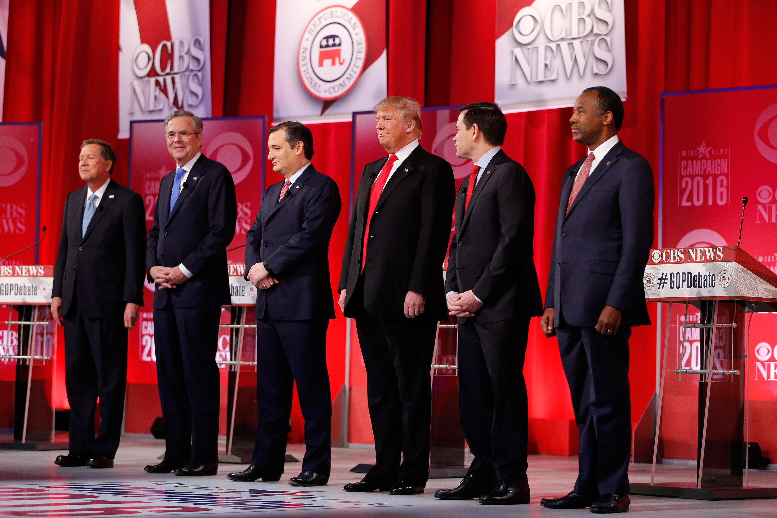 Republican presidential candidates, from left, Ohio Gov. John Kasich, former Florida Gov. Jeb Bush, Sen. Ted Cruz, R-Texas, businessman Donald Trump, Sen. Marco Rubio, R-Fla., retired neurosurgeon Ben Carson take the stage before the CBS News Republican 