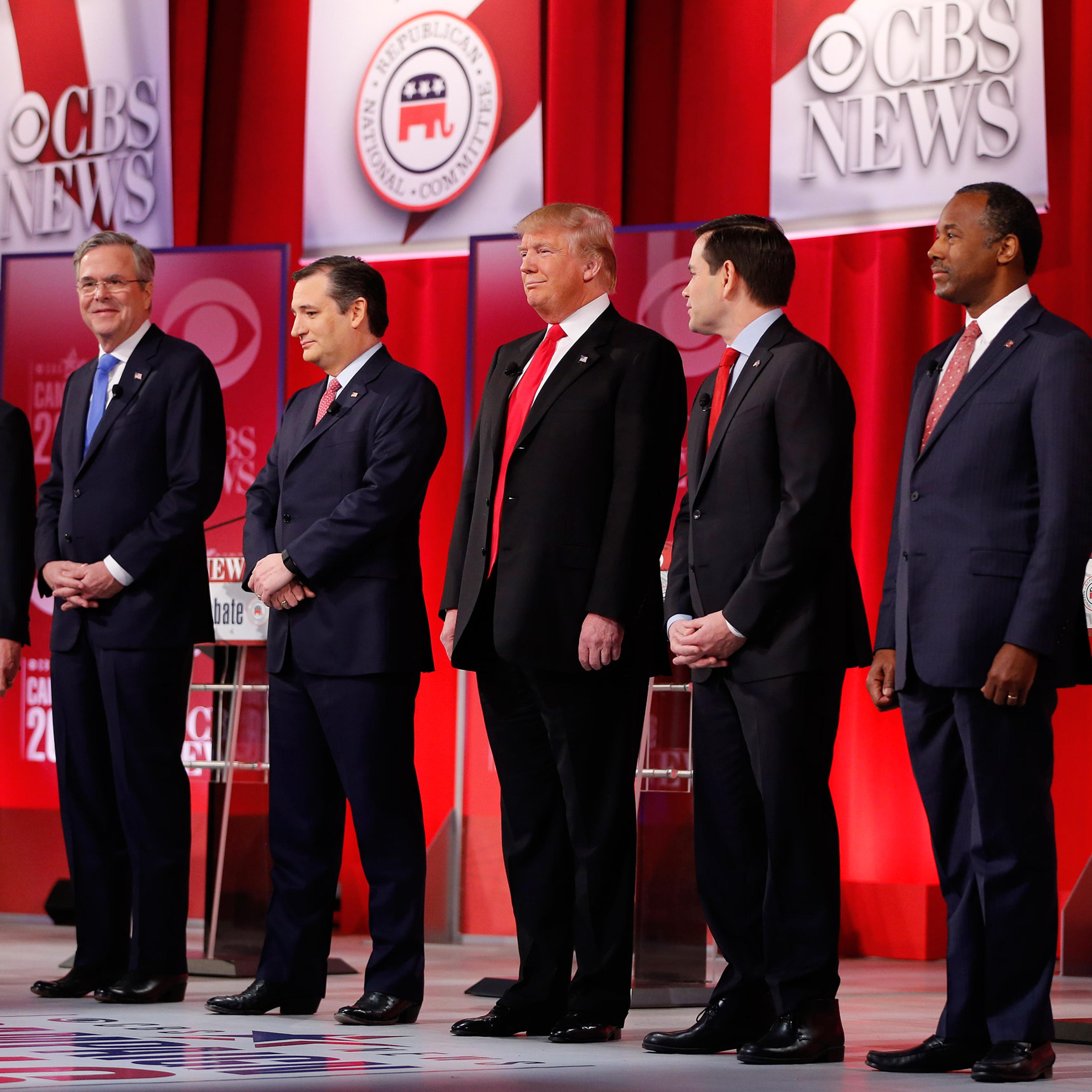 Republican presidential candidates, from left, Ohio Gov. John Kasich, former Florida Gov. Jeb Bush, Sen. Ted Cruz, R-Texas, businessman Donald Trump, Sen. Marco Rubio, R-Fla., retired neurosurgeon Ben Carson take the stage before the CBS News Republican