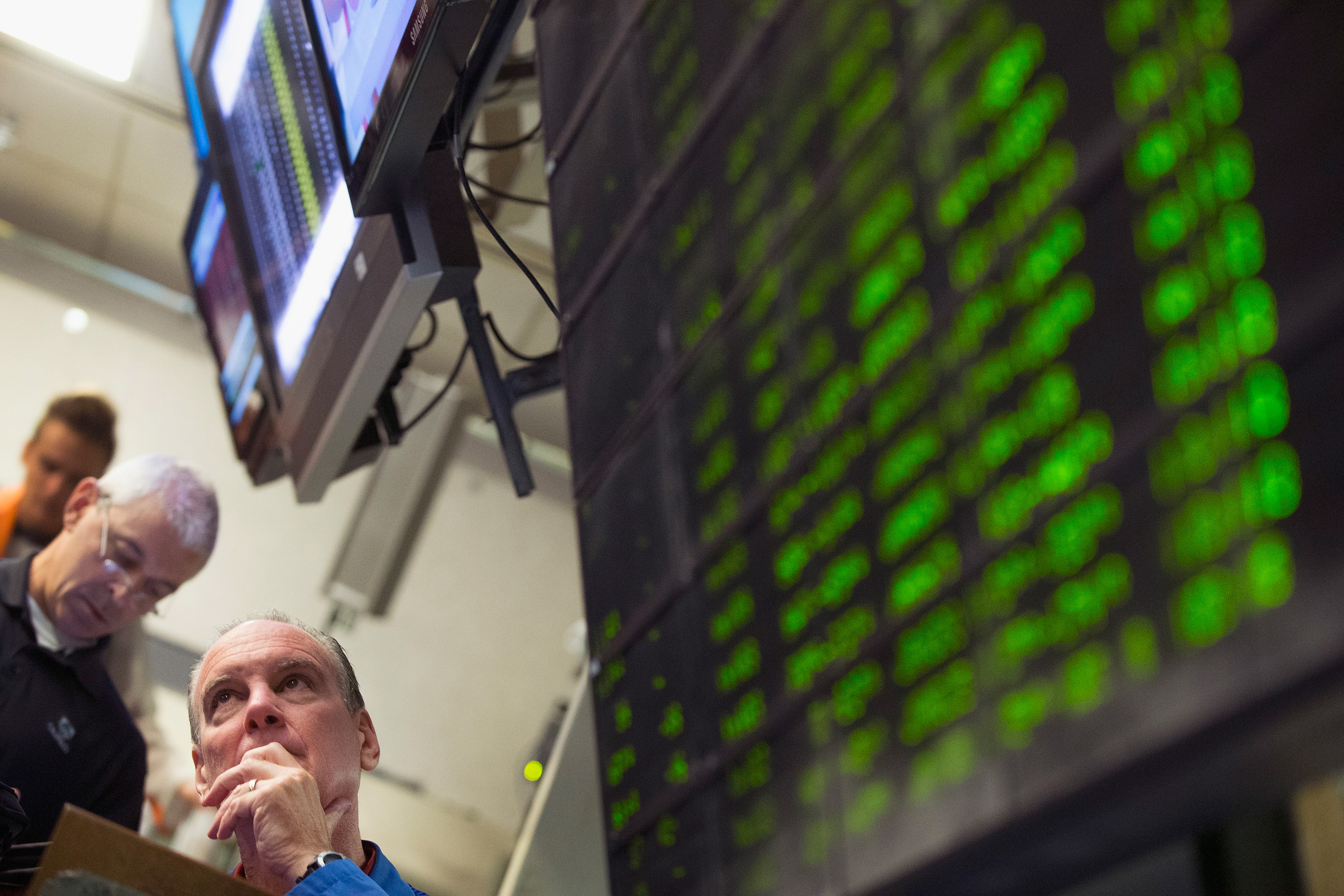 A trader monitors offers in the Standard & Poor's 500 stock index options pit at the Chicago Board Options Exchange (CBOE) on August 24, 2015 in Chicago, Illinois.