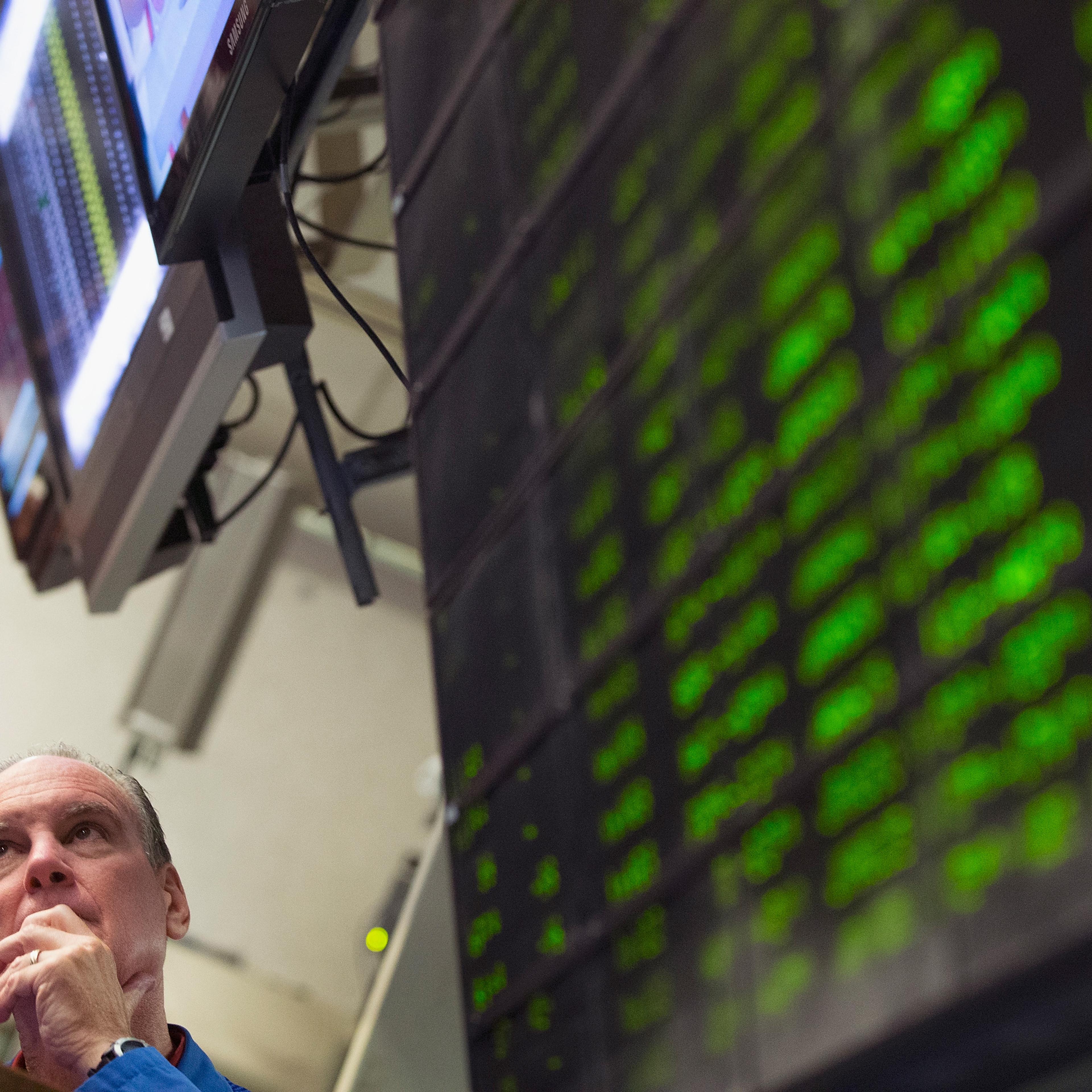 A trader monitors offers in the Standard & Poor's 500 stock index options pit at the Chicago Board Options Exchange (CBOE) on August 24, 2015 in Chicago, Illinois.