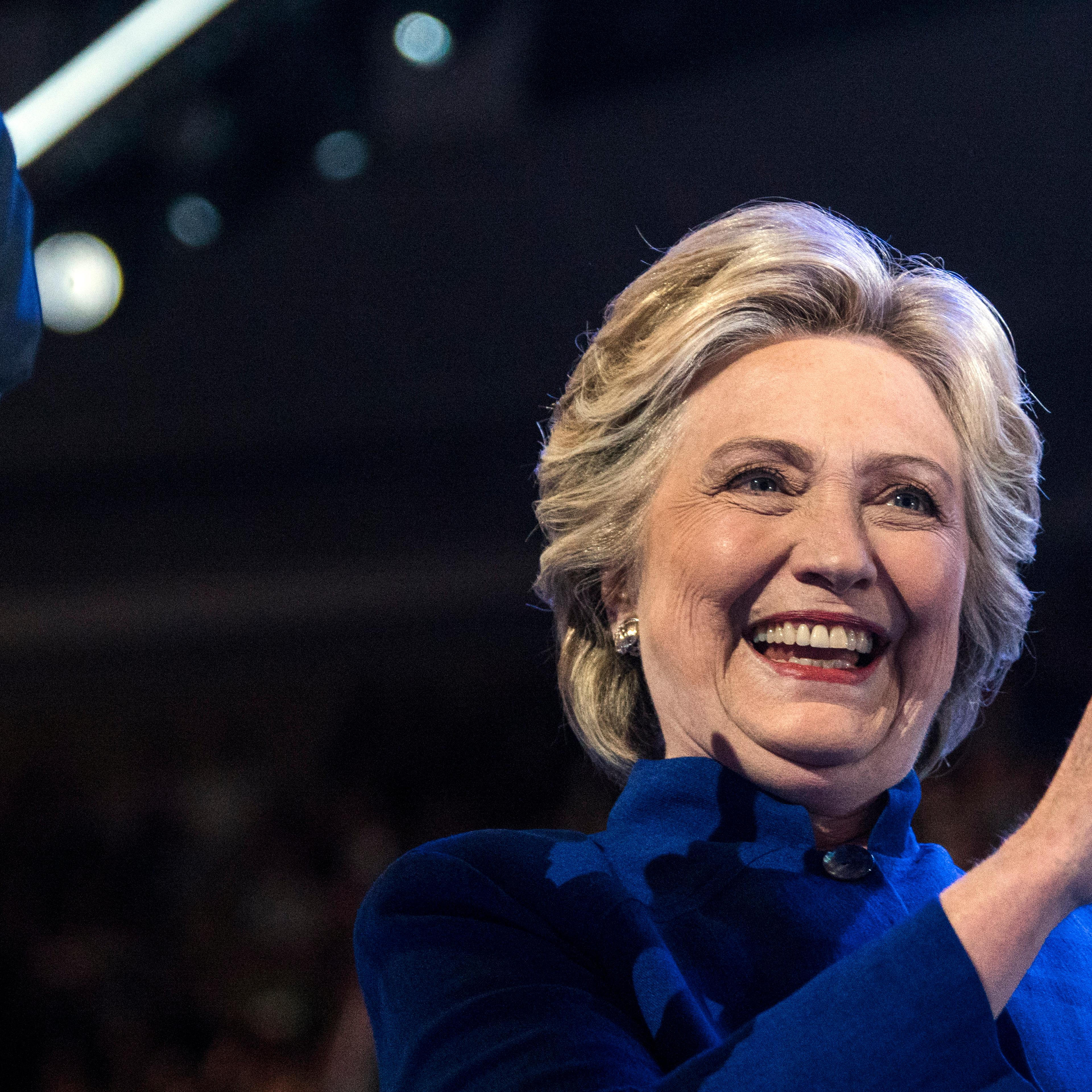 Hillary Clinton joins President Barack Obama on stage after he spoke at the Democratic National Convention in Philadelphia on July 27, 2016.