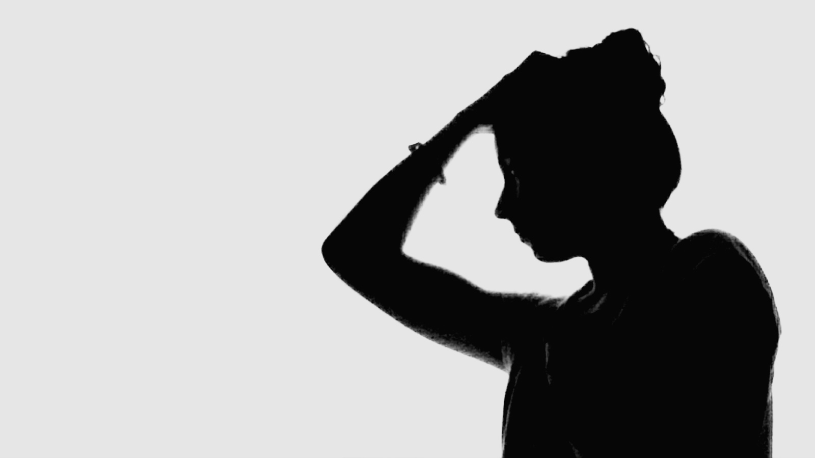 Side View Of Silhouette Woman Against White Background
