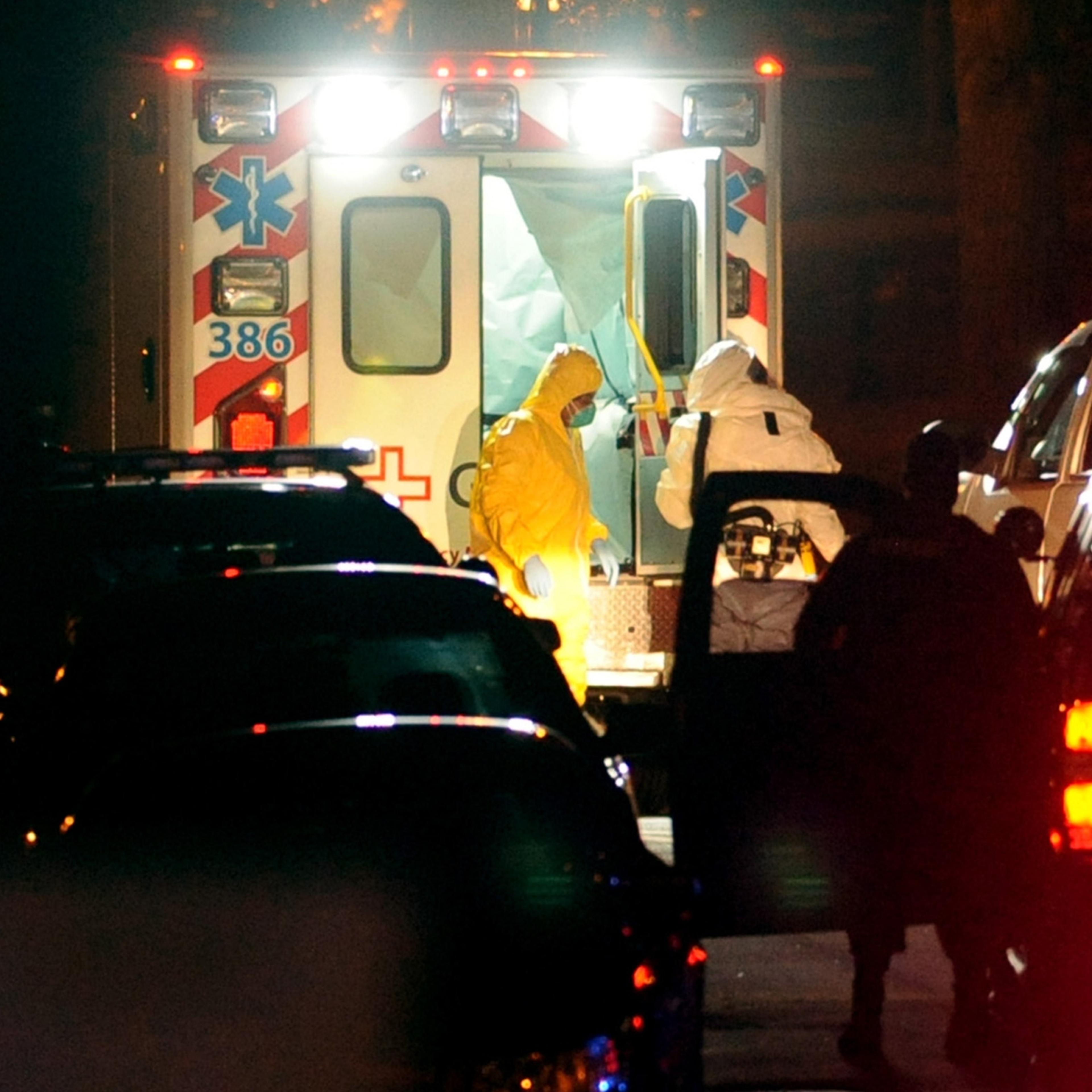 Texas nurse Amber Vinson (L) steps from an ambulance at Emory University Hospital in Atlanta
