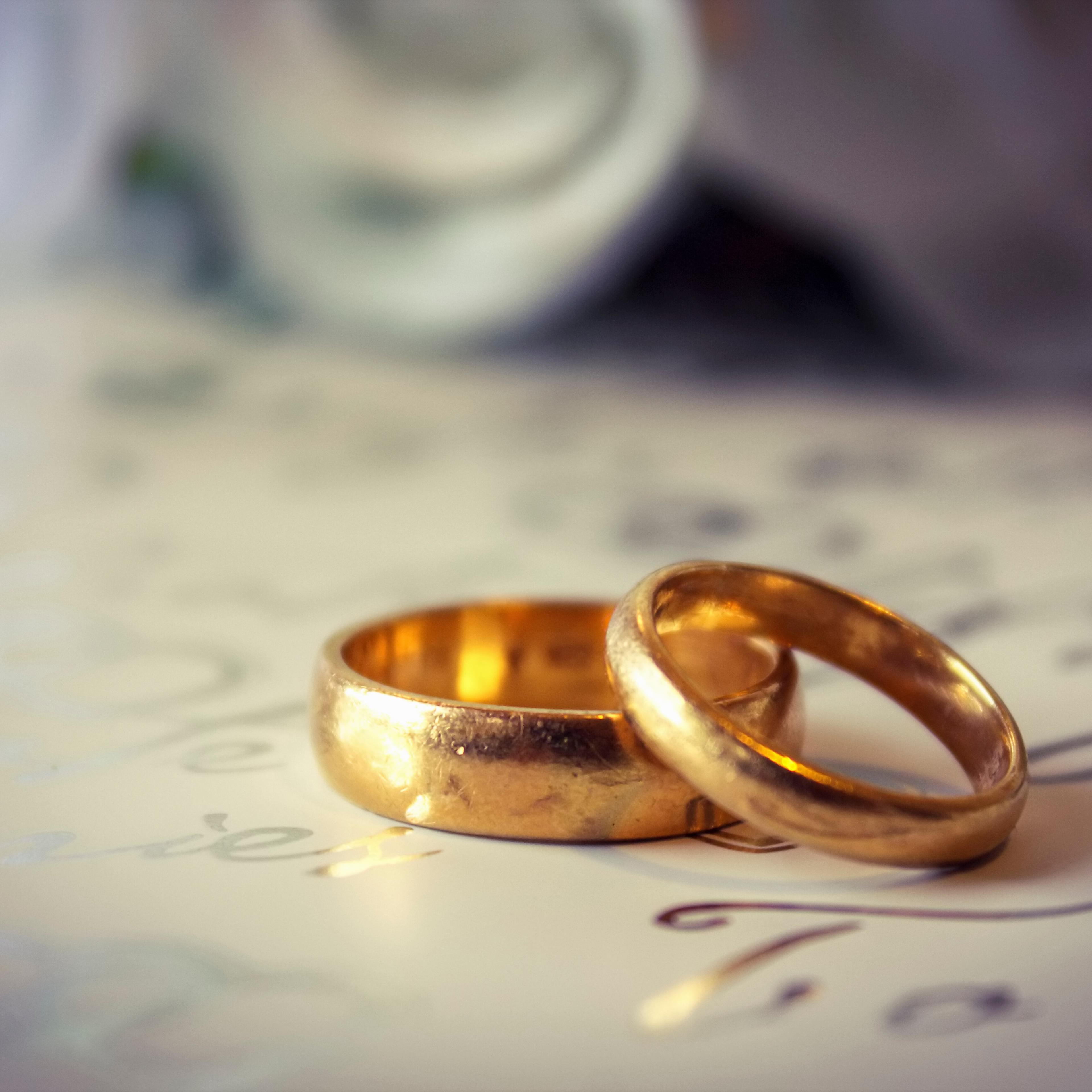 Close up of gold wedding bands.
