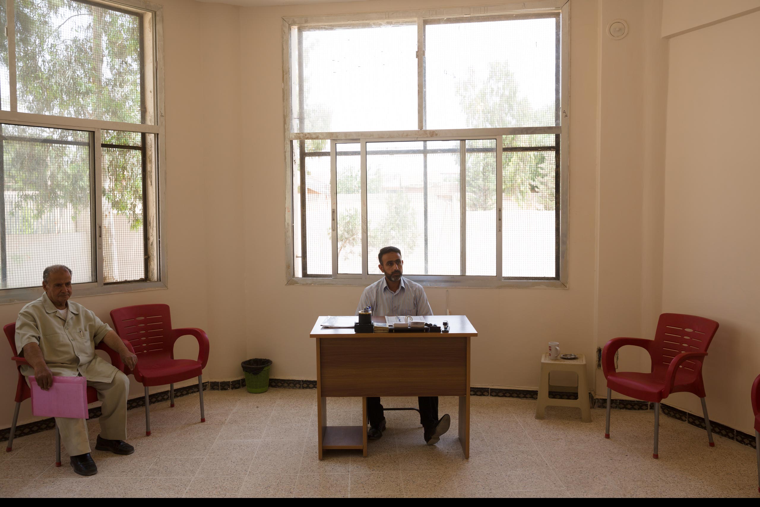 A judge in in a temporary office of Deir-ez Zor's  state-run court handles mainly administrative matters like birth and wedding certificates. In areas in Syria and Iraq where ISIS is in control, Sharia law prevails, May 25, 2015.