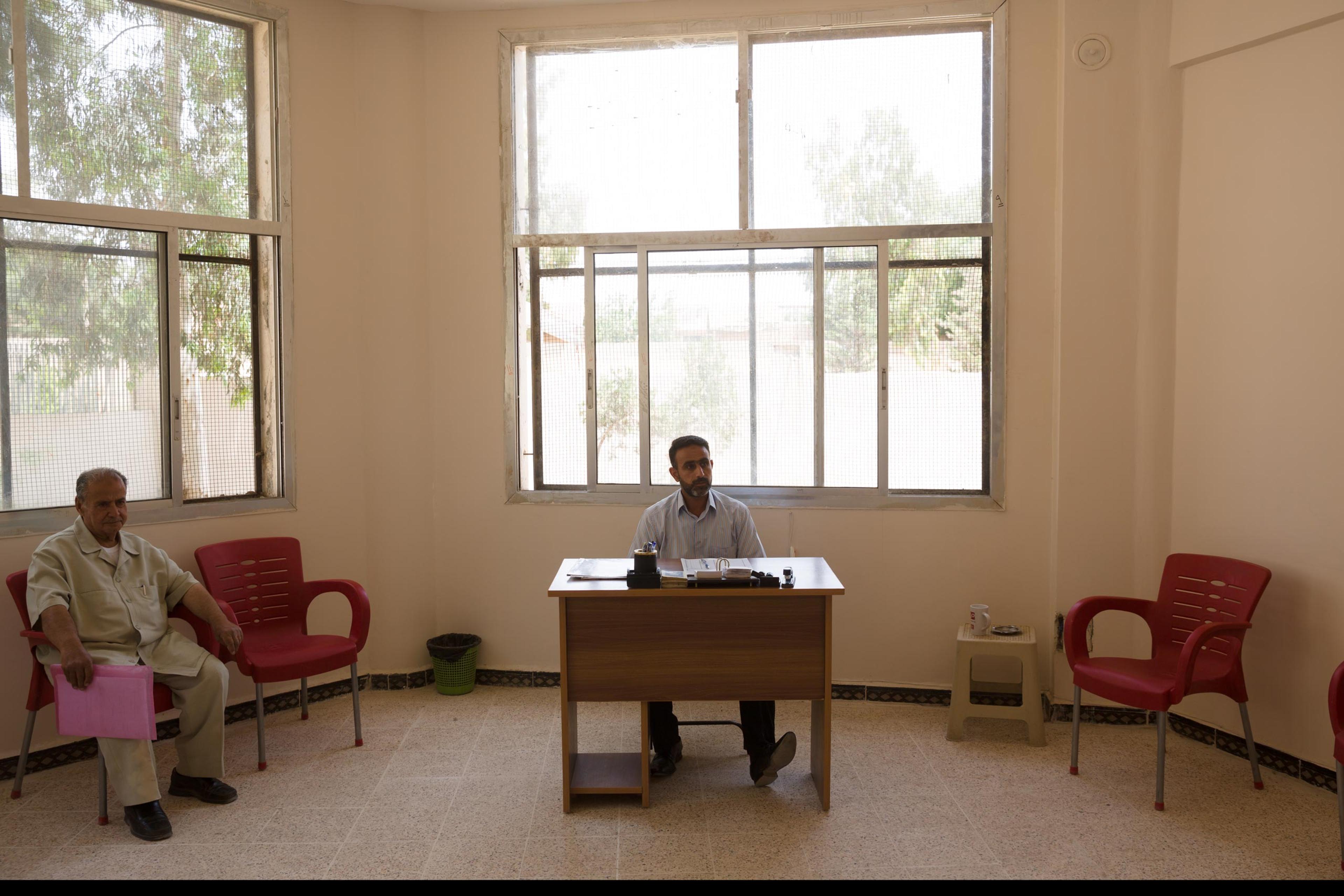A judge in in a temporary office of Deir-ez Zor's state-run court handles mainly administrative matters like birth and wedding certificates. In areas in Syria and Iraq where ISIS is in control, Sharia law prevails, May 25, 2015.