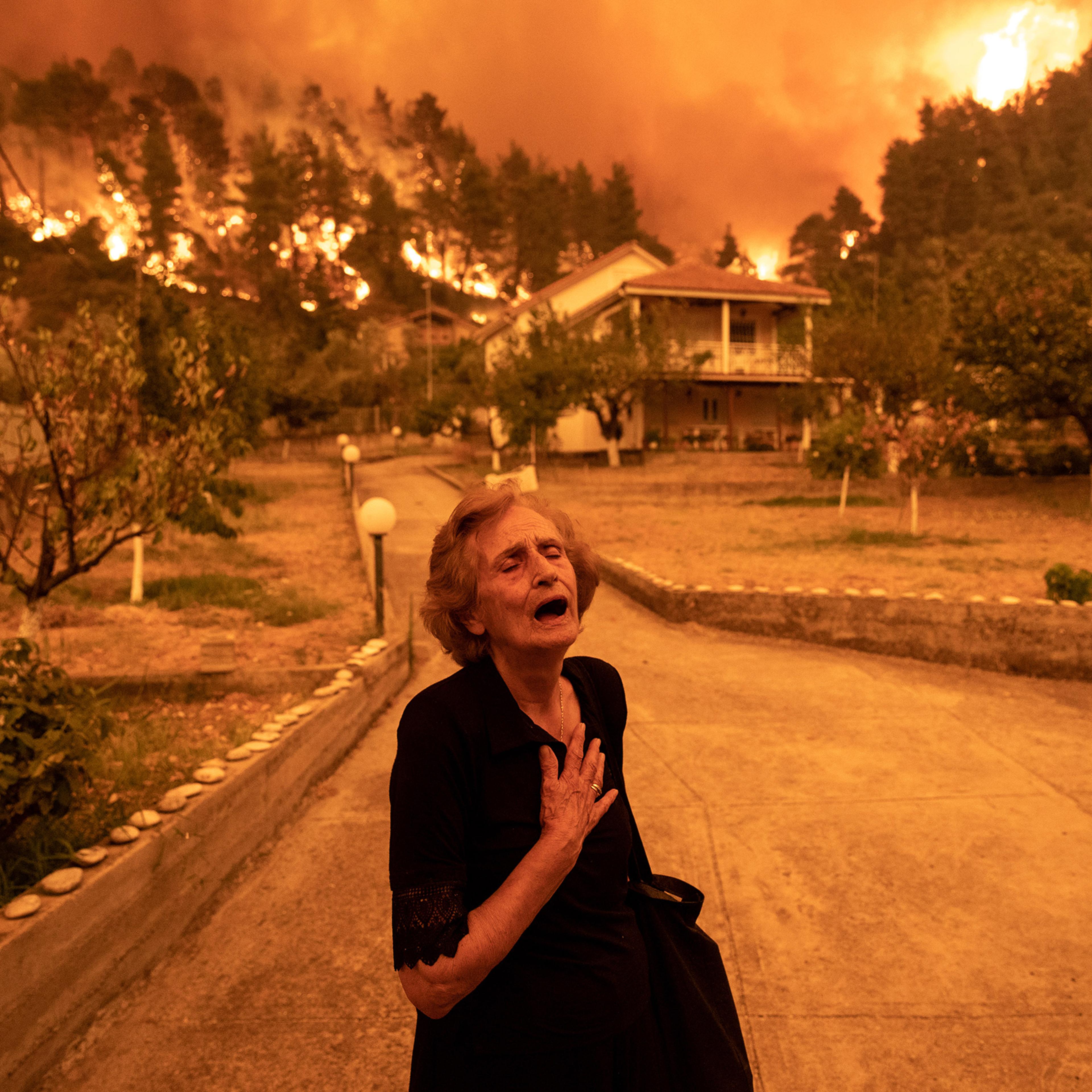 Residents Evacuate Greek Island Hit By Wildfires