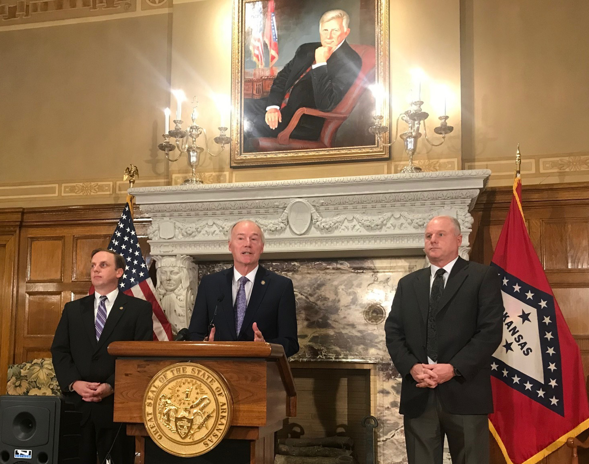 Arkansas Gov. Asa Hutchinson speaks at a news conference about a ruling against the state's work requirement for its Medicaid expansion program at the state Capitol in Little Rock, Ark.