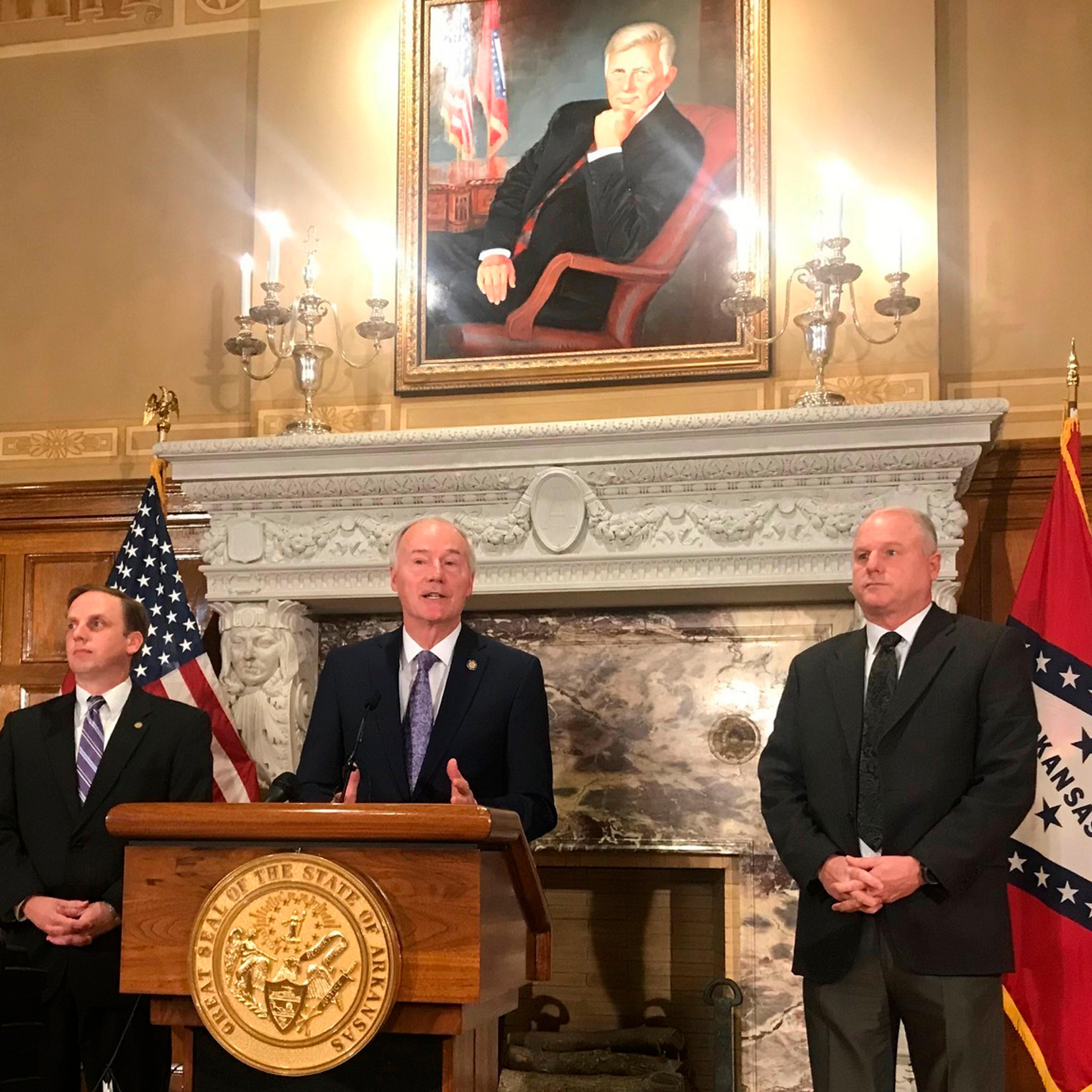 Arkansas Gov. Asa Hutchinson speaks at a news conference about a ruling against the state's work requirement for its Medicaid expansion program at the state Capitol in Little Rock, Ark.