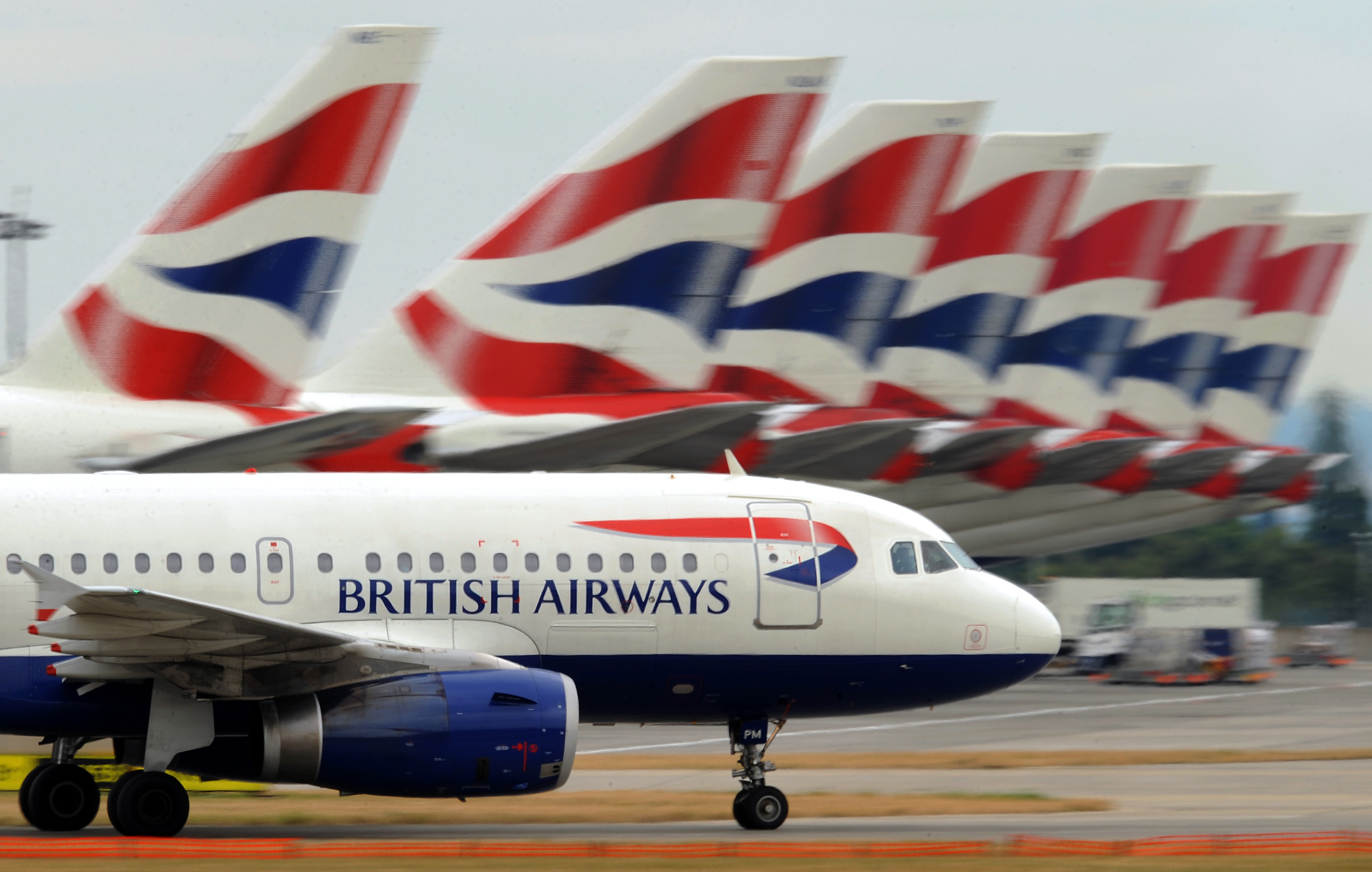 A British Airways aircraft taxis past ot