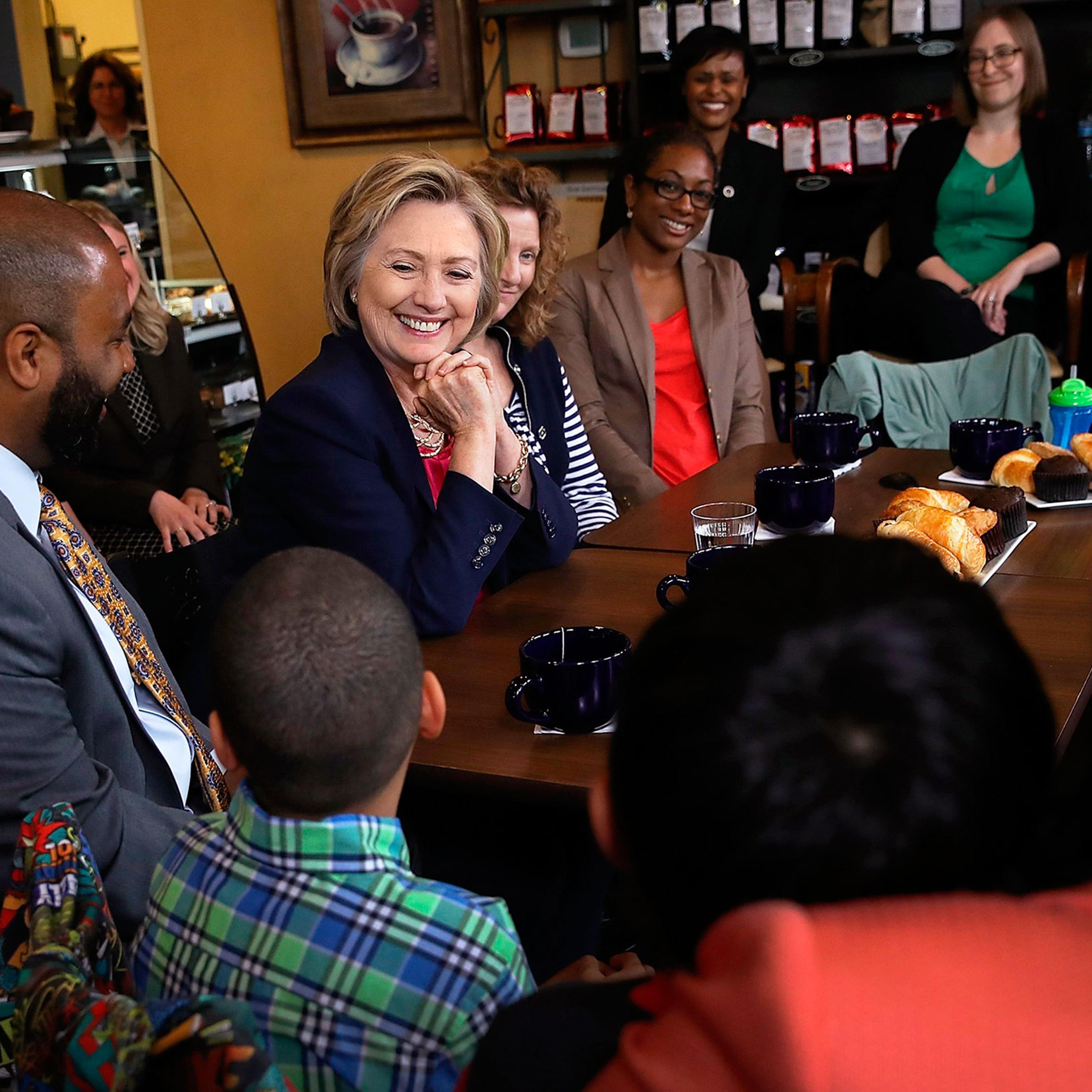 Clinton meets with voters on May 9 at Mug’n Muffin bakery in Aldie, Va.