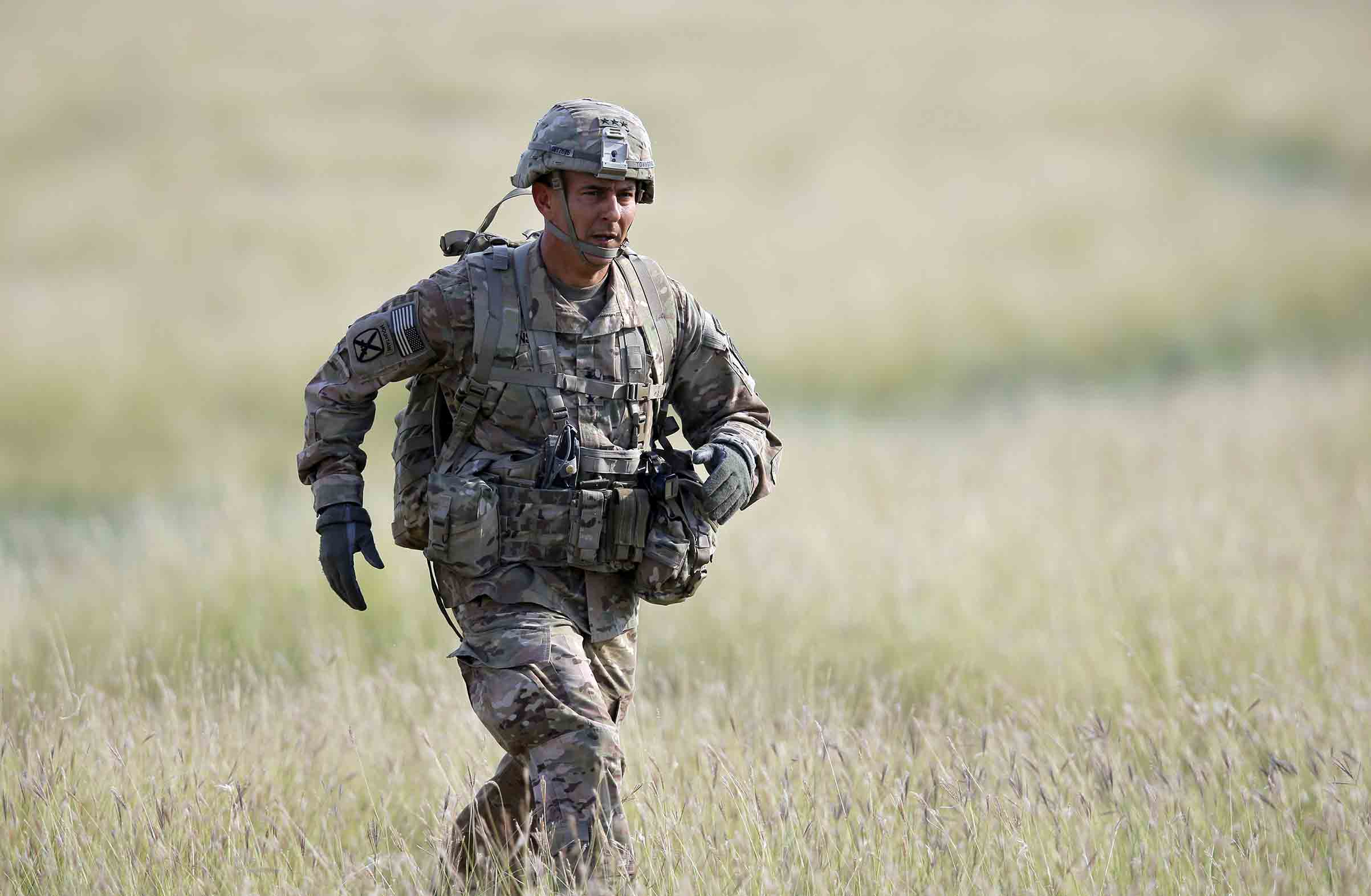 Maj. Gen. Stephen J. Townsend, the commander of the 18th Airborne Corps, runs towards the media working area during an US Army-led airborne assault exercise named 'Swift Response 15', held at Smardan shooting range, 260 kilometers north-east of Bucharest