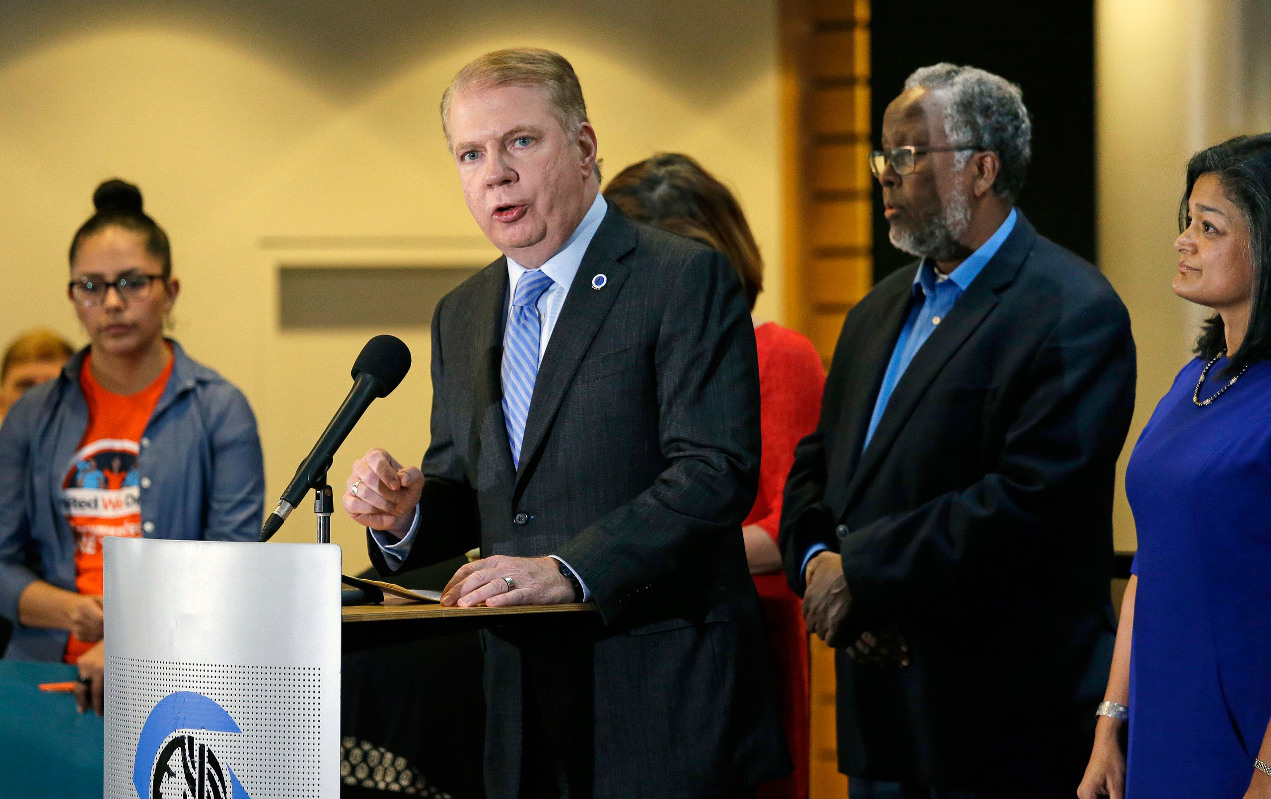 FILE - In this Nov. 9, 2016, file photo, Seattle Mayor Ed Murray, second left, speaks at a post-election event of elected officials and community leaders at City Hall in Seattle. Leaders in Seattle, San Francisco and other so-called "sanctuary cities" sa