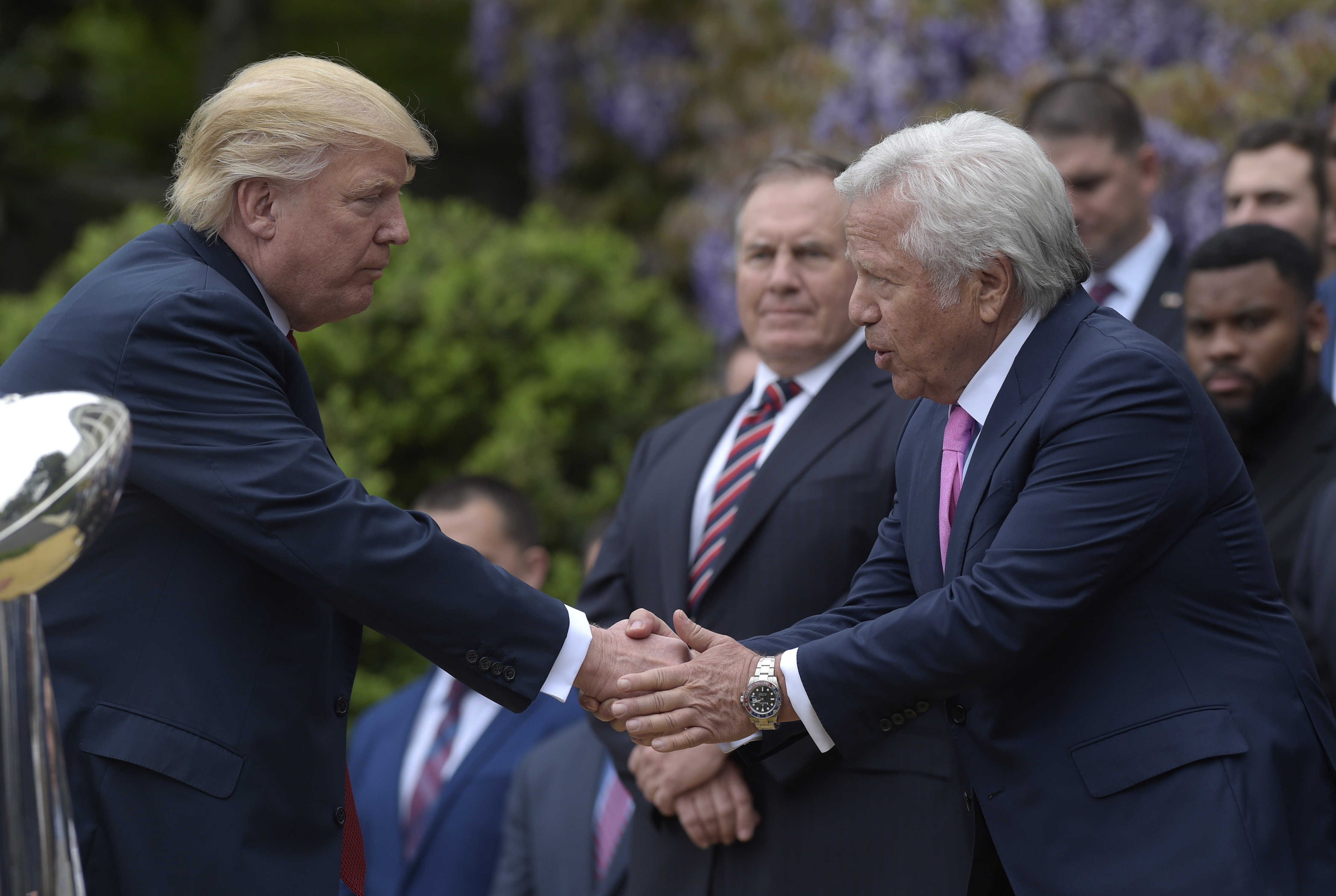 President Donald Trump shakes hands with New England Patriots owner Robert Kraft
