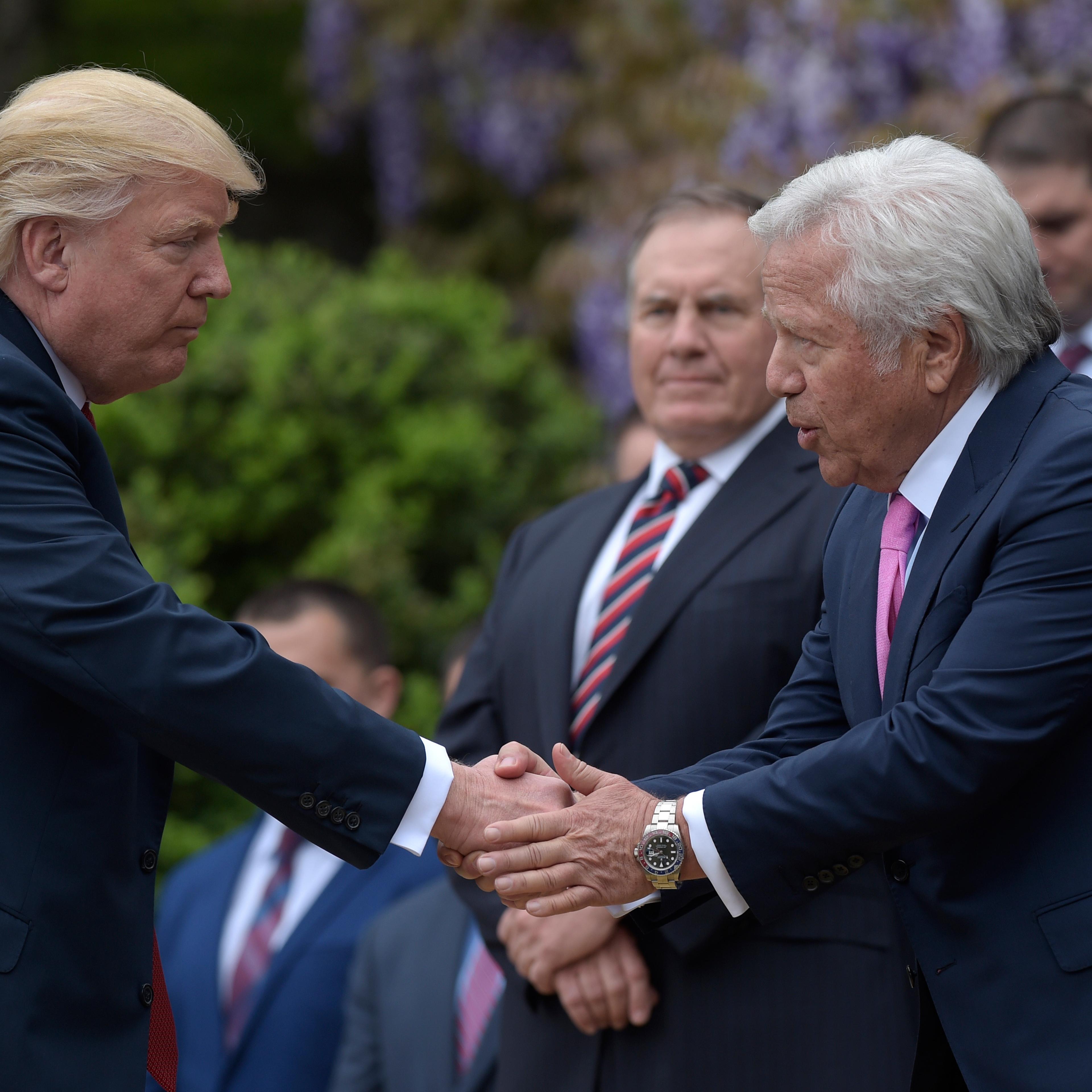 President Donald Trump shakes hands with New England Patriots owner Robert Kraft