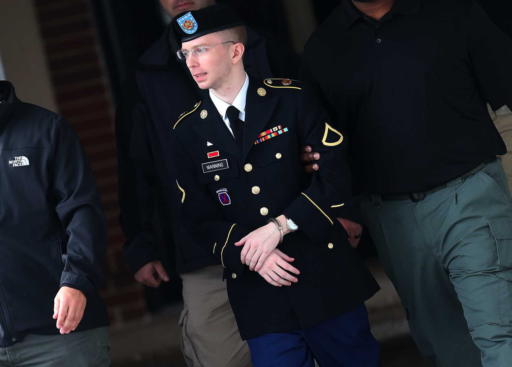 U.S. Army Private First Class Bradley Manning is escorted out of a military court during the sentencing phase of her trial in Fort Meade, Md., on Aug. 20, 2013