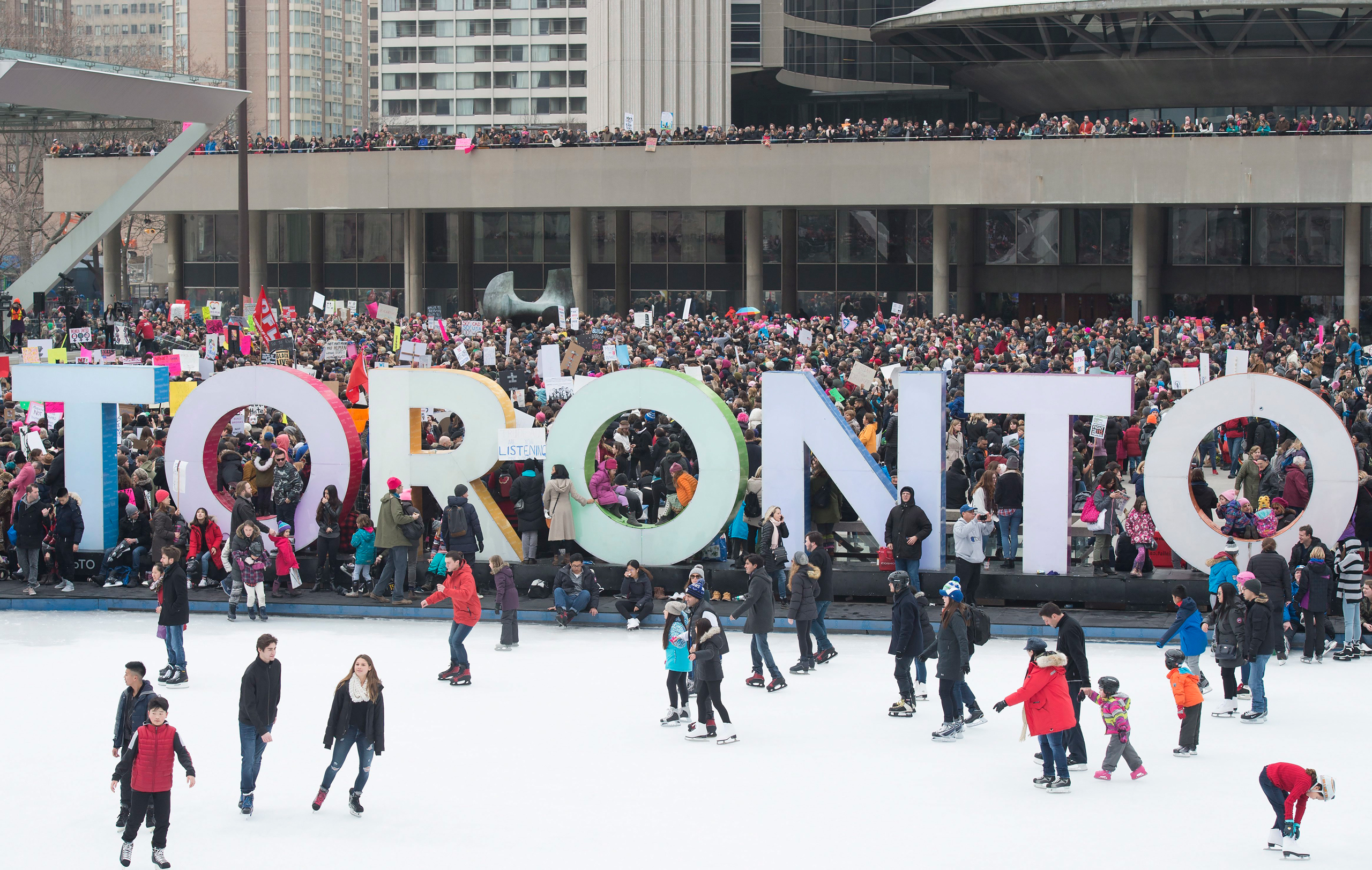 Protesters march gather in Nathan Phillips Square, in support of the Women's March on Washington, in Toronto on Saturday, January 21, 2017. Protests are being held across Canada today in support of the Women's March on Washington. Organizers say 30 event