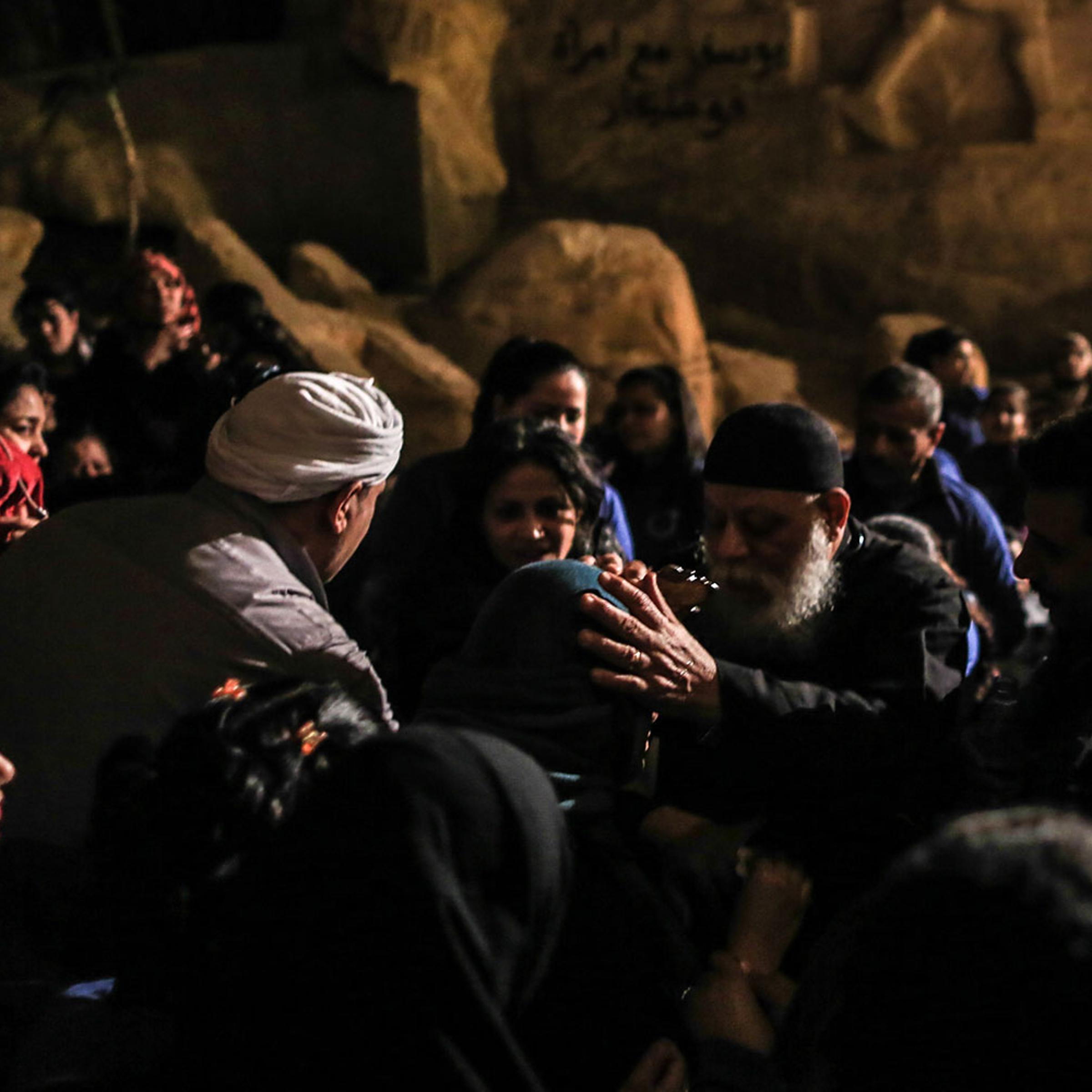 Father Sama’an Ibrahim performs an exorcism on a group of devotees - Muslims and Christians - inside Cairo’s St. Sama’an Cathedral, Feb. 28, 2014.