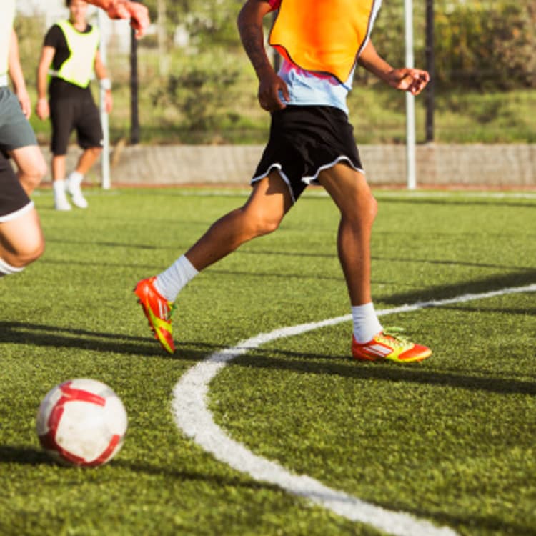 soccer-players-playing-field