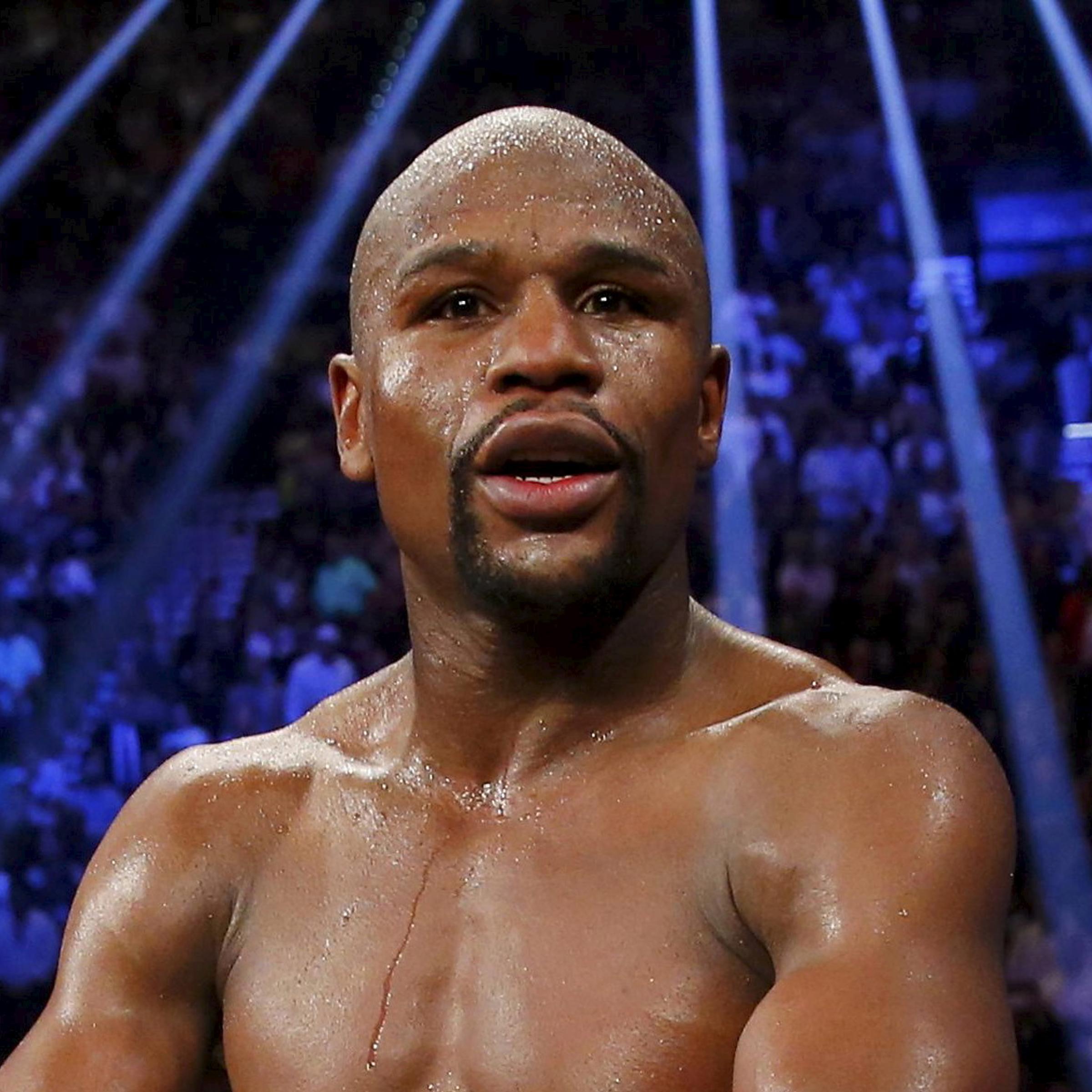 Mayweather, Jr. of the U.S. celebrates after defeating Pacquiao of the Philippines in their welterweight title fight in Las Vegas