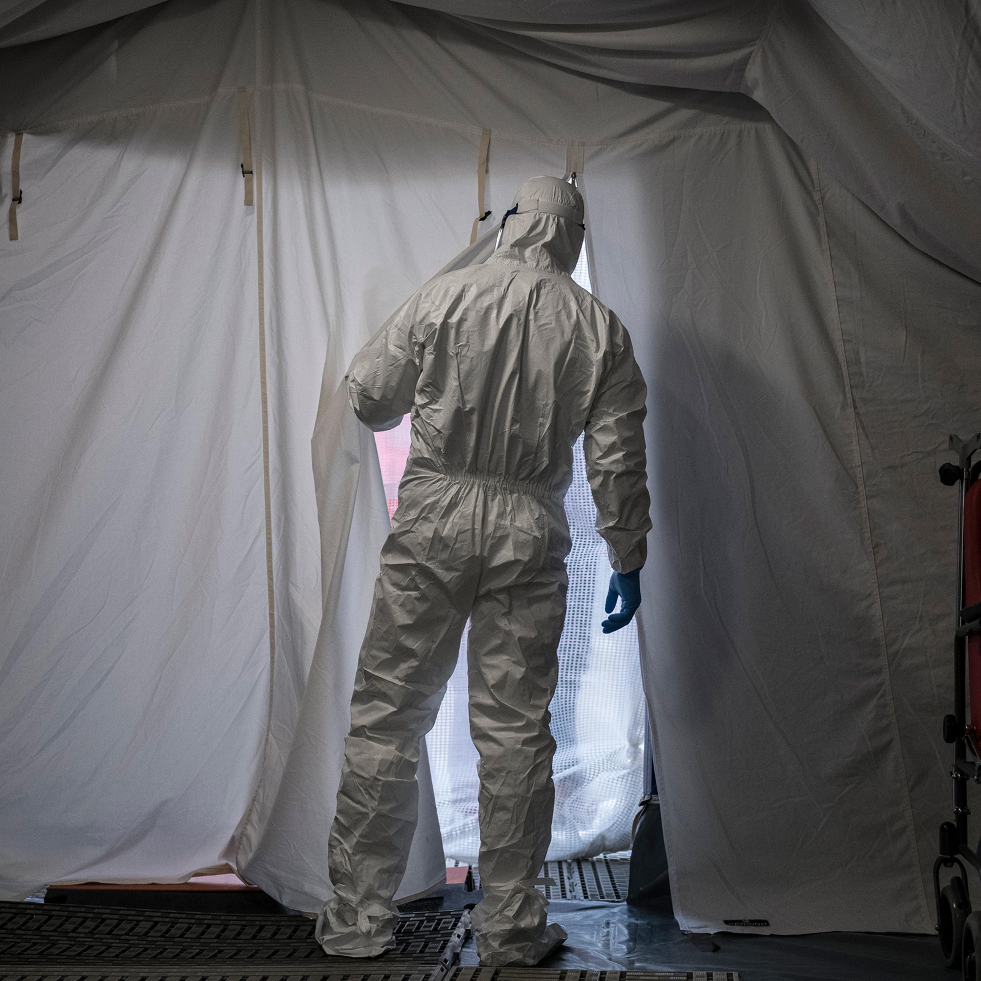 A health care worker wears protective gear at the San Giovanni Bosco Hospital in Turin, Italy, on Feb. 27