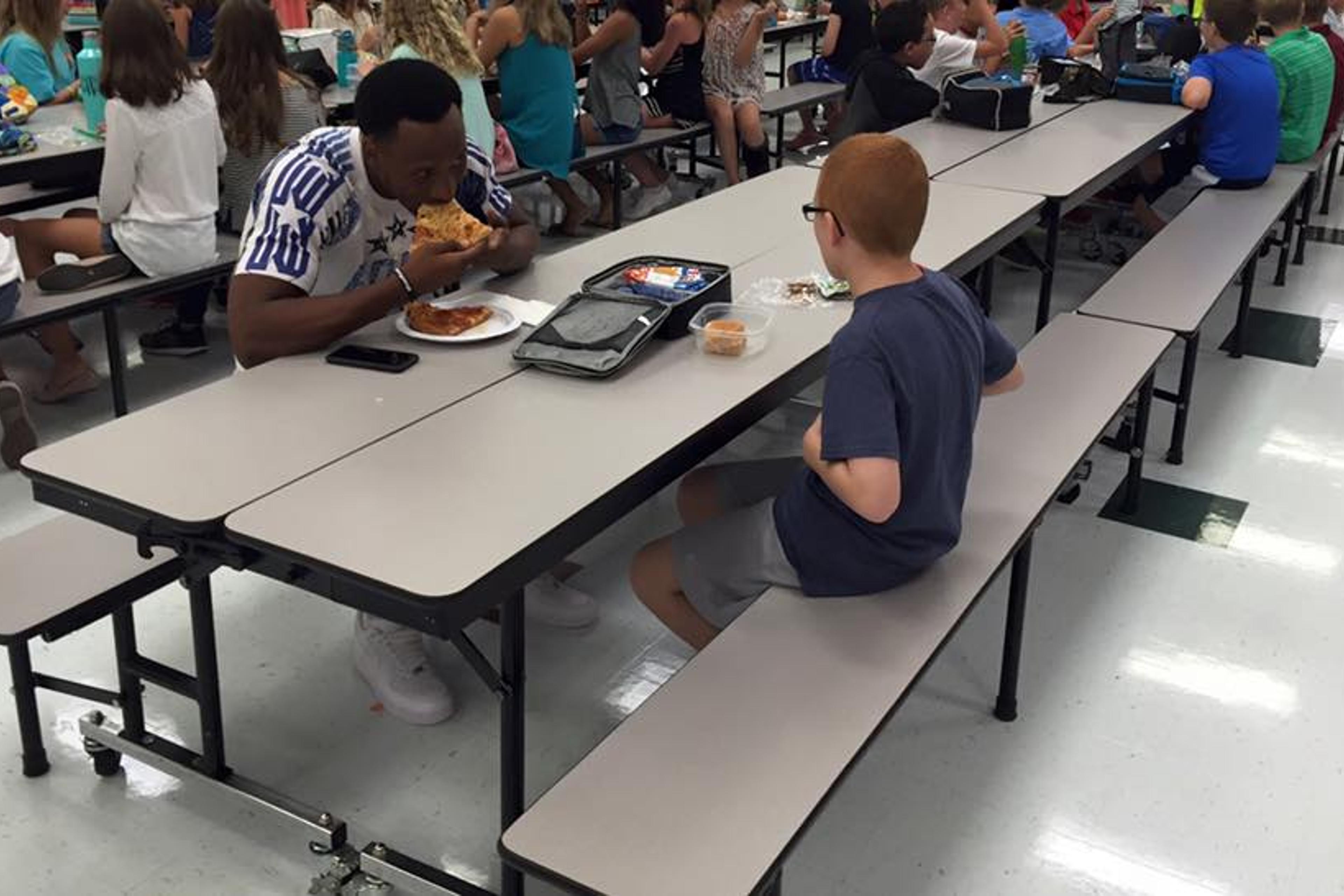 Leah Paske, 39, shared this photo on Facebook of the touching moment between Florida State University wide receiver Travis Rudolph and her son Bo.