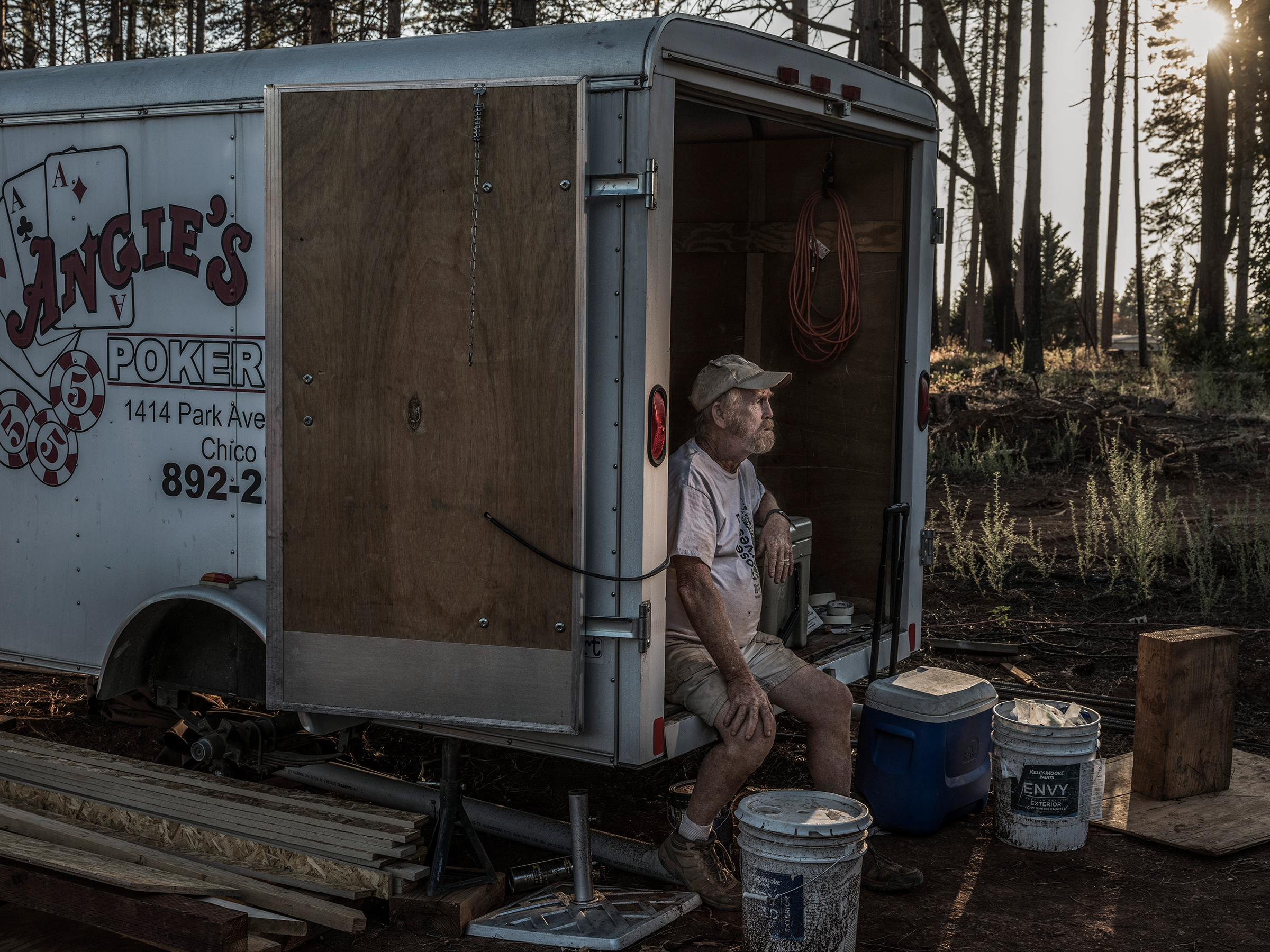 Former Paradise Mayor Steve "Woody" Culleton sits in a small storage trailer on his property where he is rebuilding his home
