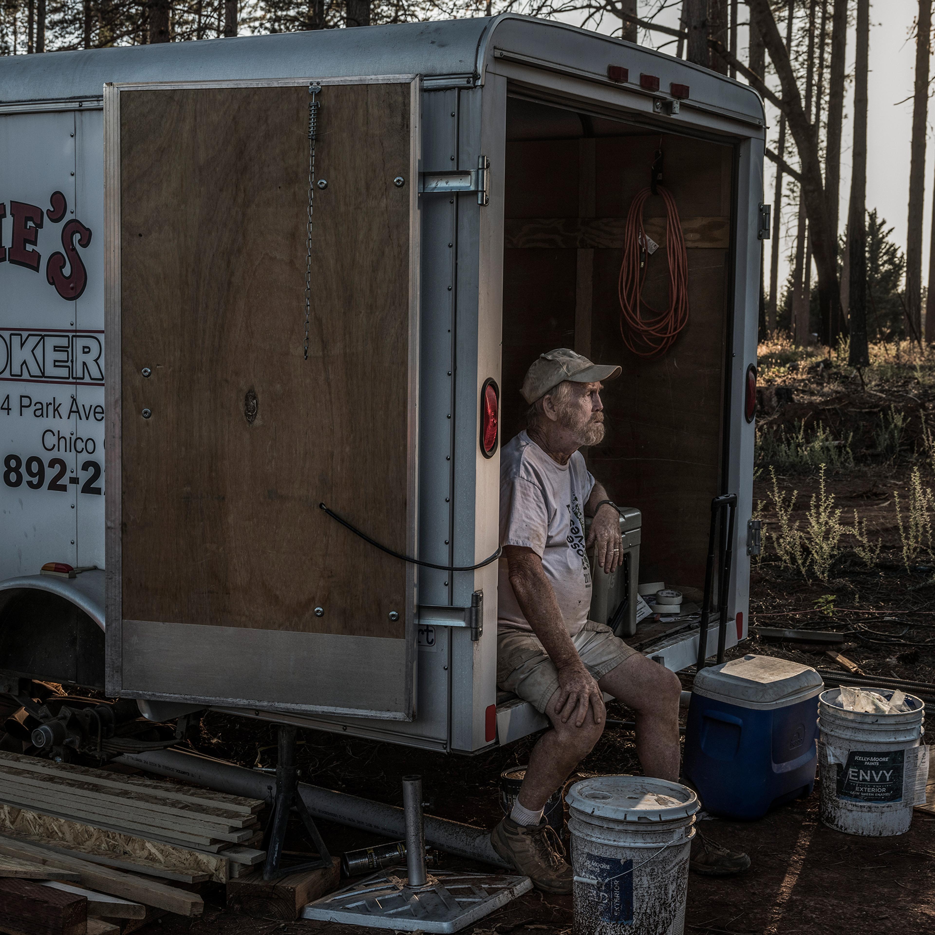 Former Paradise Mayor Steve "Woody" Culleton sits in a small storage trailer on his property where he is rebuilding his home