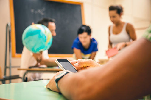student-using-smartphone-closeup