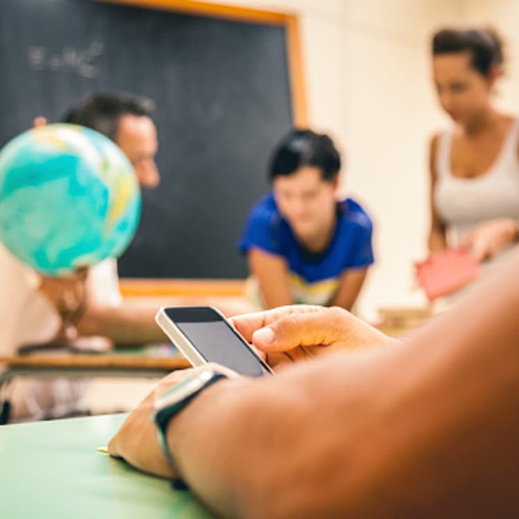 student-using-smartphone-closeup