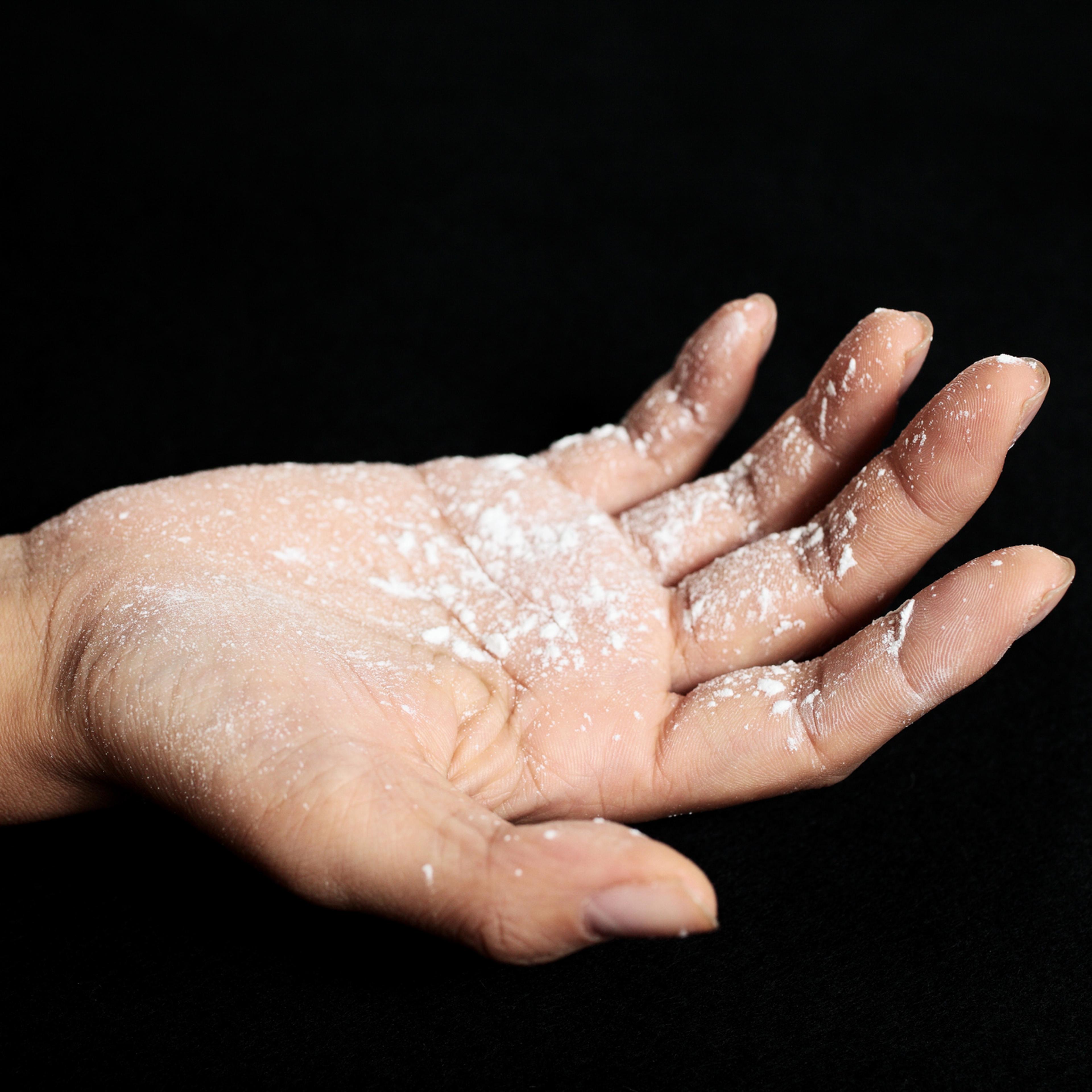Hand covered with talcum powder