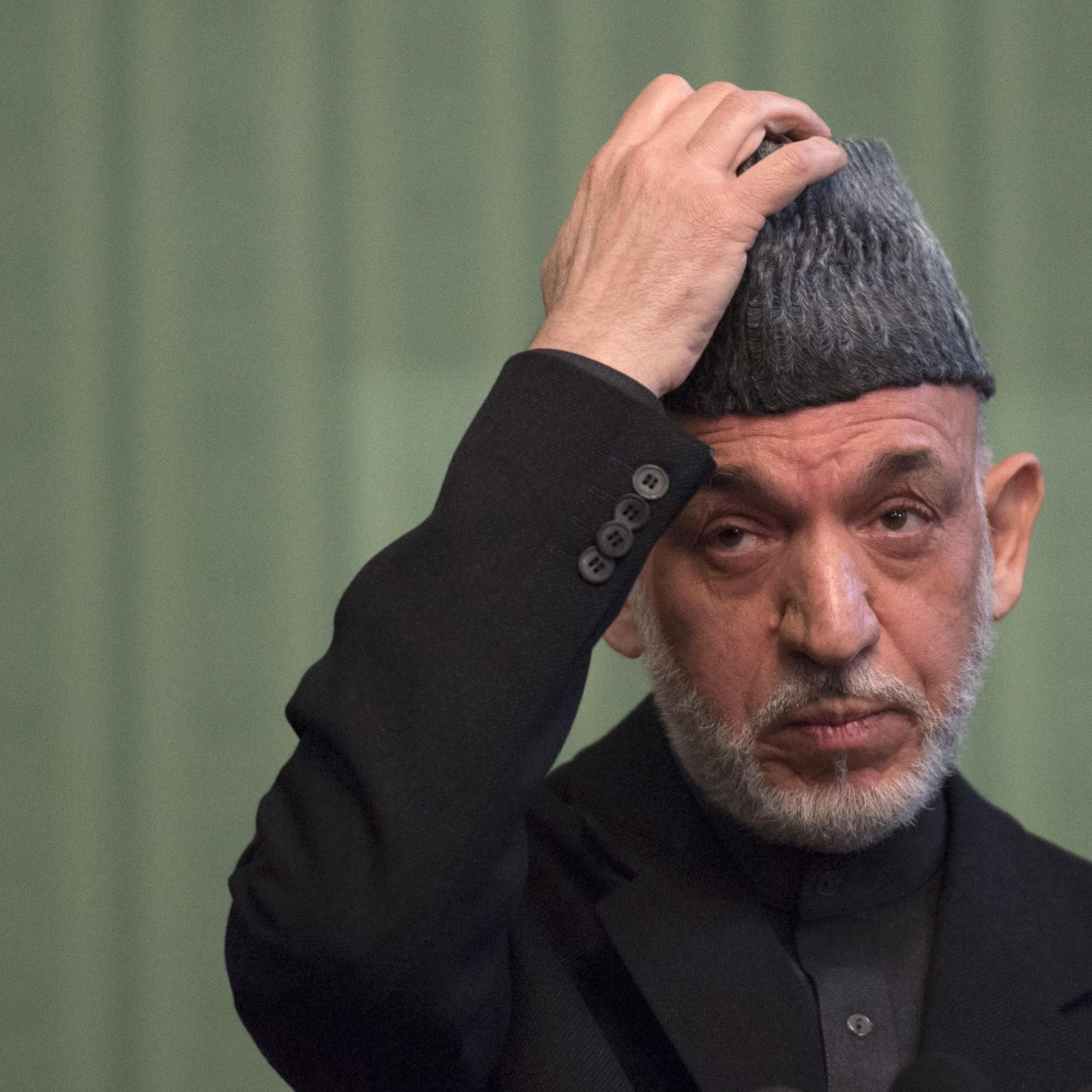 Afghan President Hamid Karzai gestures during a press conference at the Presidential Palace in Kabul on January 25, 2014.