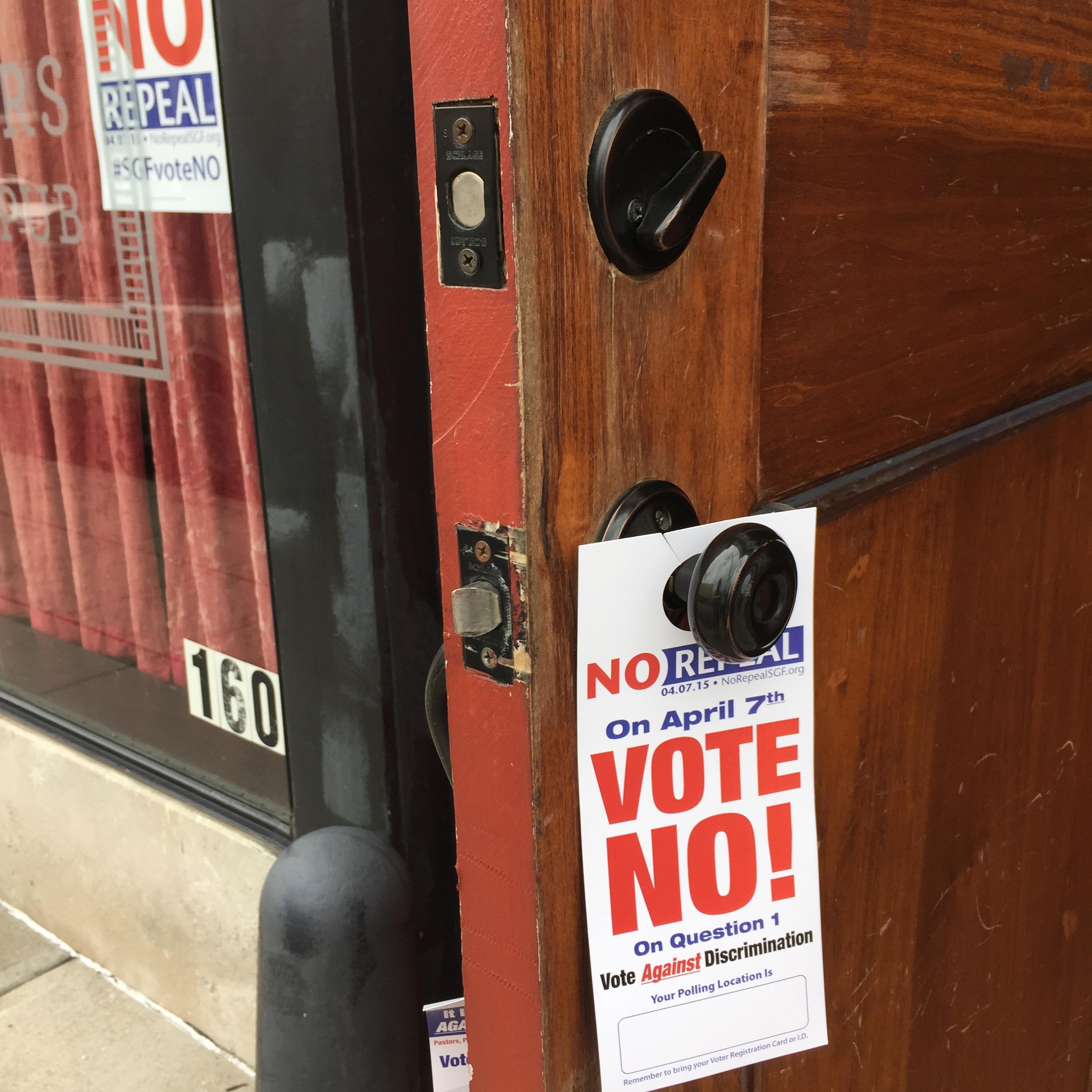 Signs hung at a business in Springfield, Mo., express support for upholding a local non-discrimination measure for LGBT residents, which was repealed on April 7, 2015.