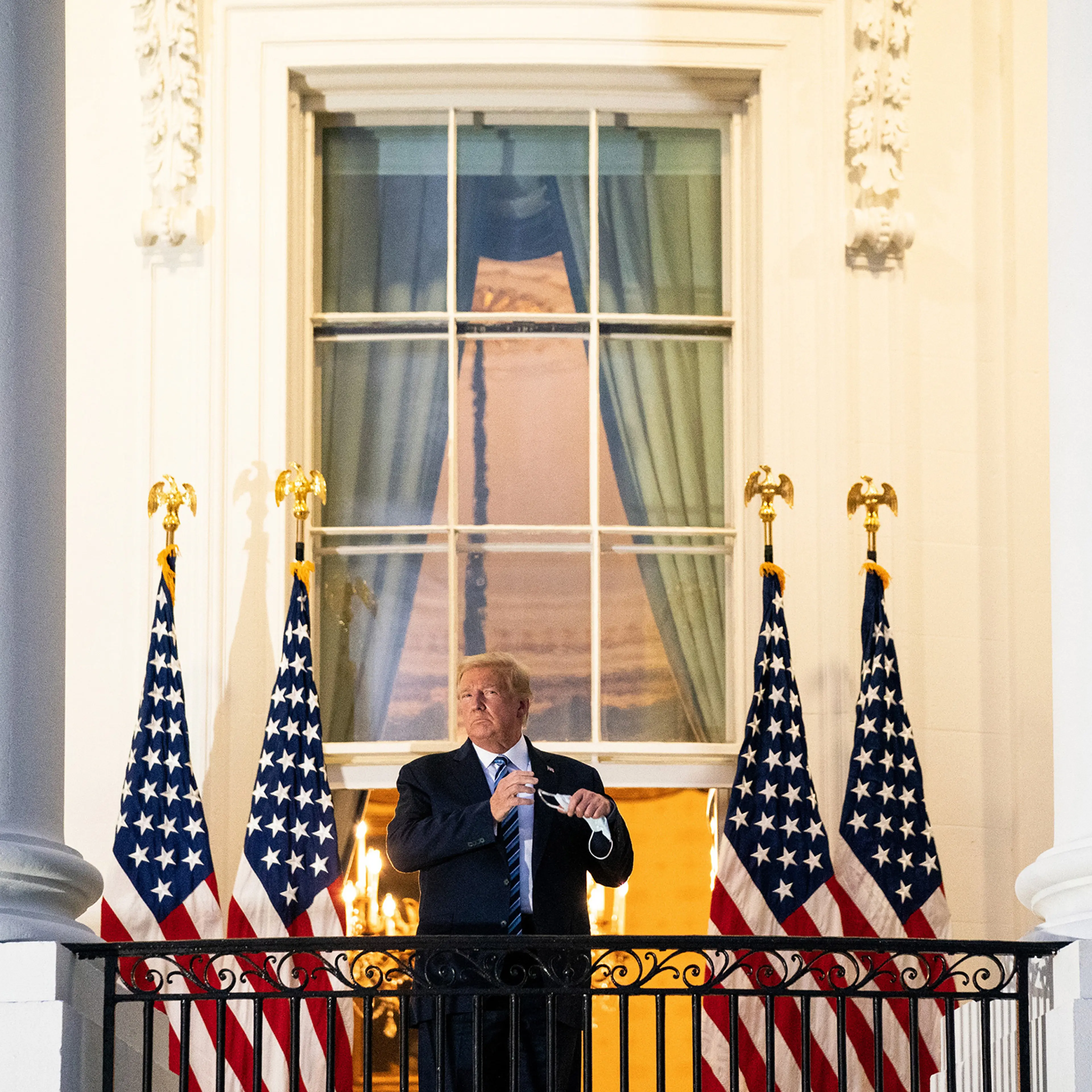President Trump stages a theatrical return to the White House on Oct. 5 after three days of hospitalization for COVID-19