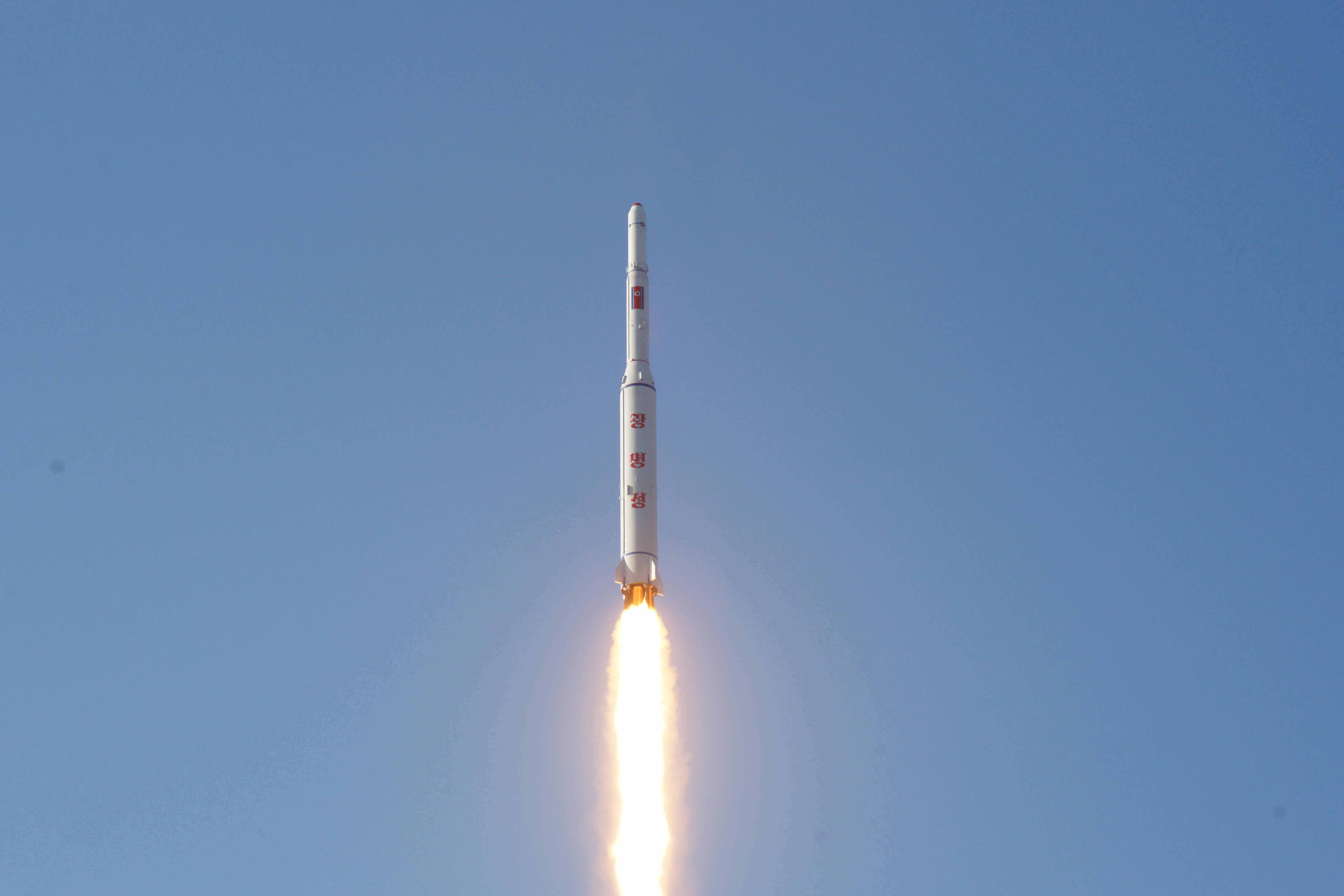 A North Korean long-range rocket is launched into the air at the Sohae rocket launch site in this undated photo released by North Korea's Korean Central News Agency (KCNA) in Pyongyang