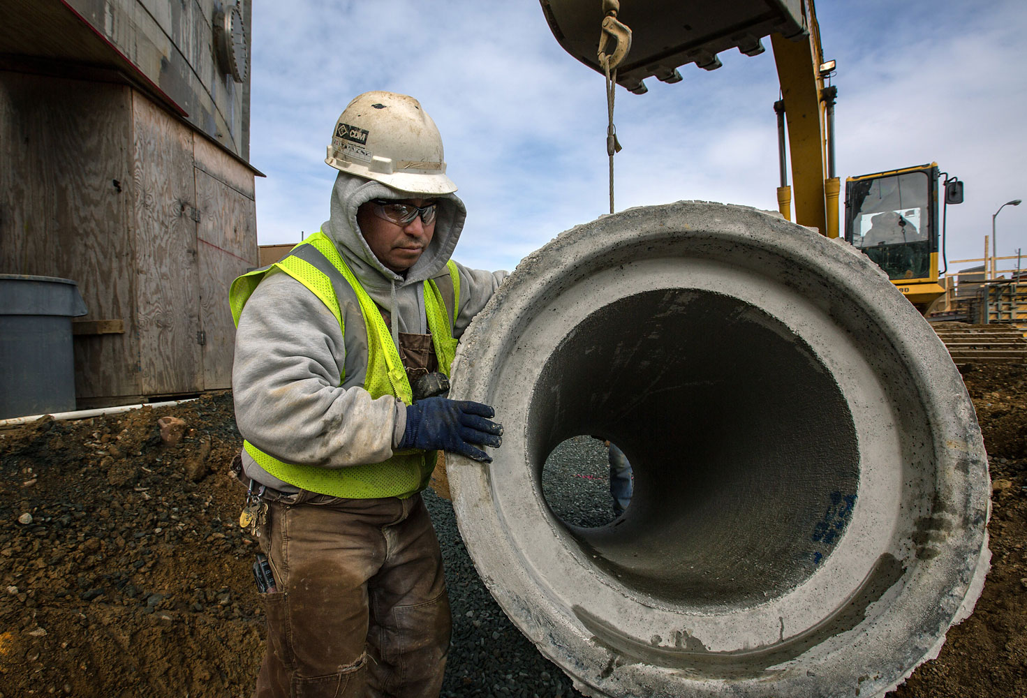 Construction worker installs storm water drain pipes at a hydrolysis wastewater treatment project in Washington, D.C., March 18, 2014.