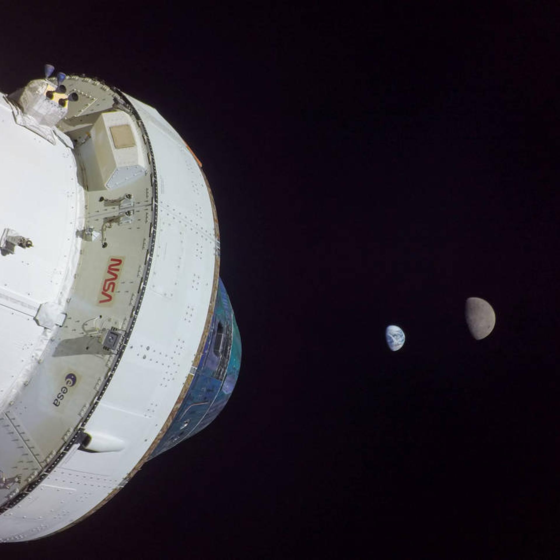 The Orion spacecraft used an exterior camera to take this selfie, with the Earth and the moon in the background