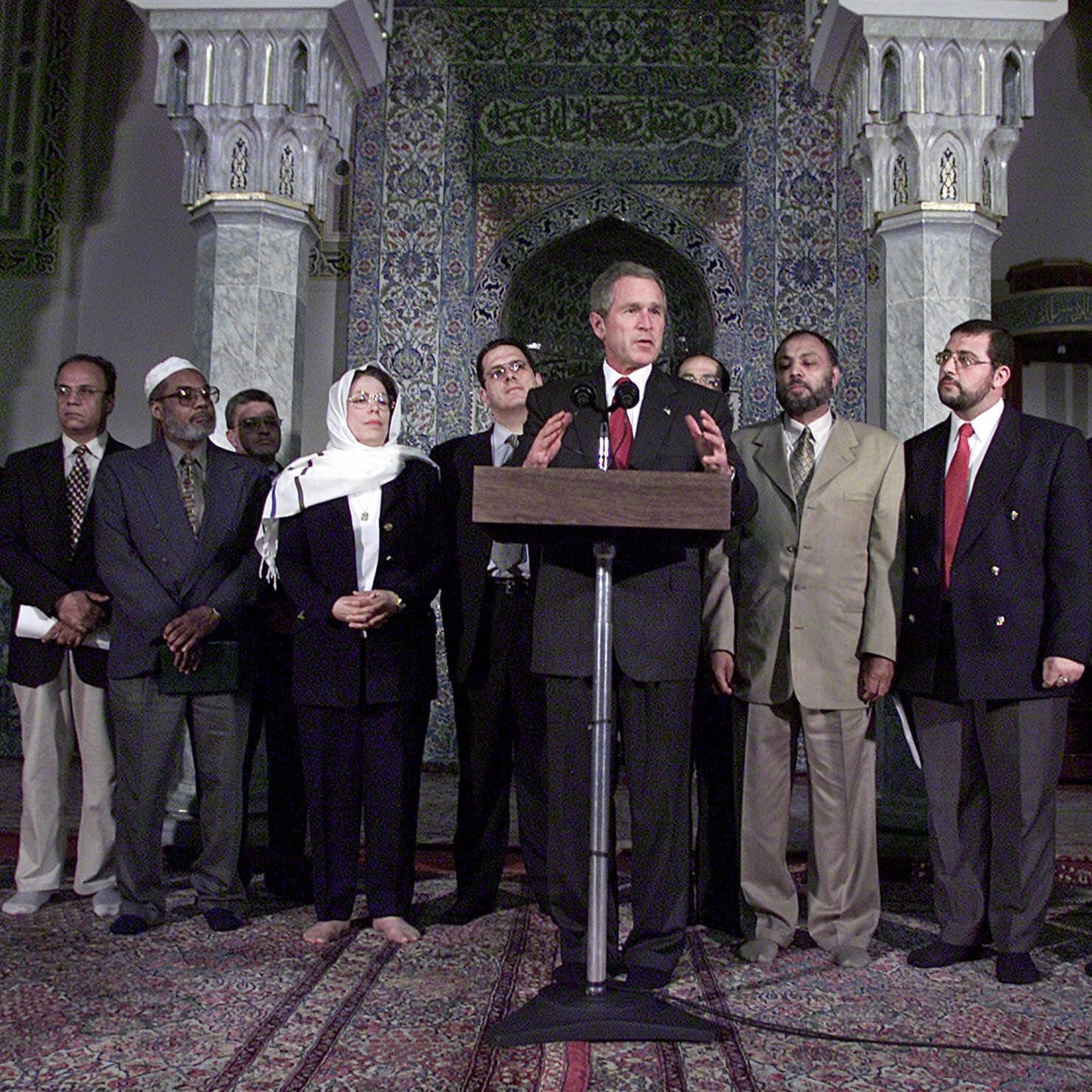 President Bush stands with Islamic leaders during a visit to the Islamic Center of Washington, Monday, Sept. 17, 2001, to try to put an end to rising anti-Muslim sentiment in the wake of last week's terrorist attacks.