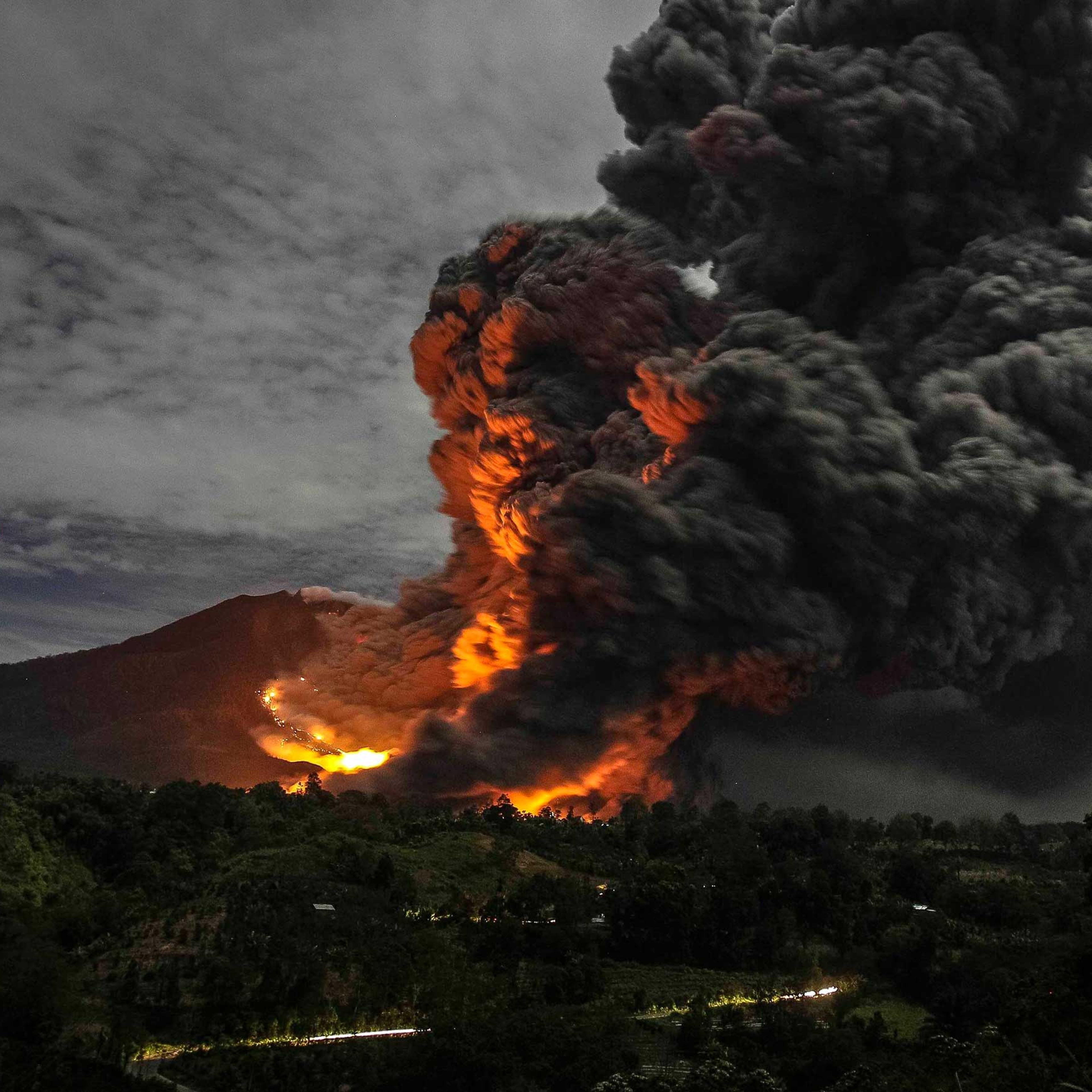 Mount Sinabung volcano erupts, as seen from Tiga Pancur village, Karo Regency in Indonesia's North Sumatra province on Oct. 8, 2014.