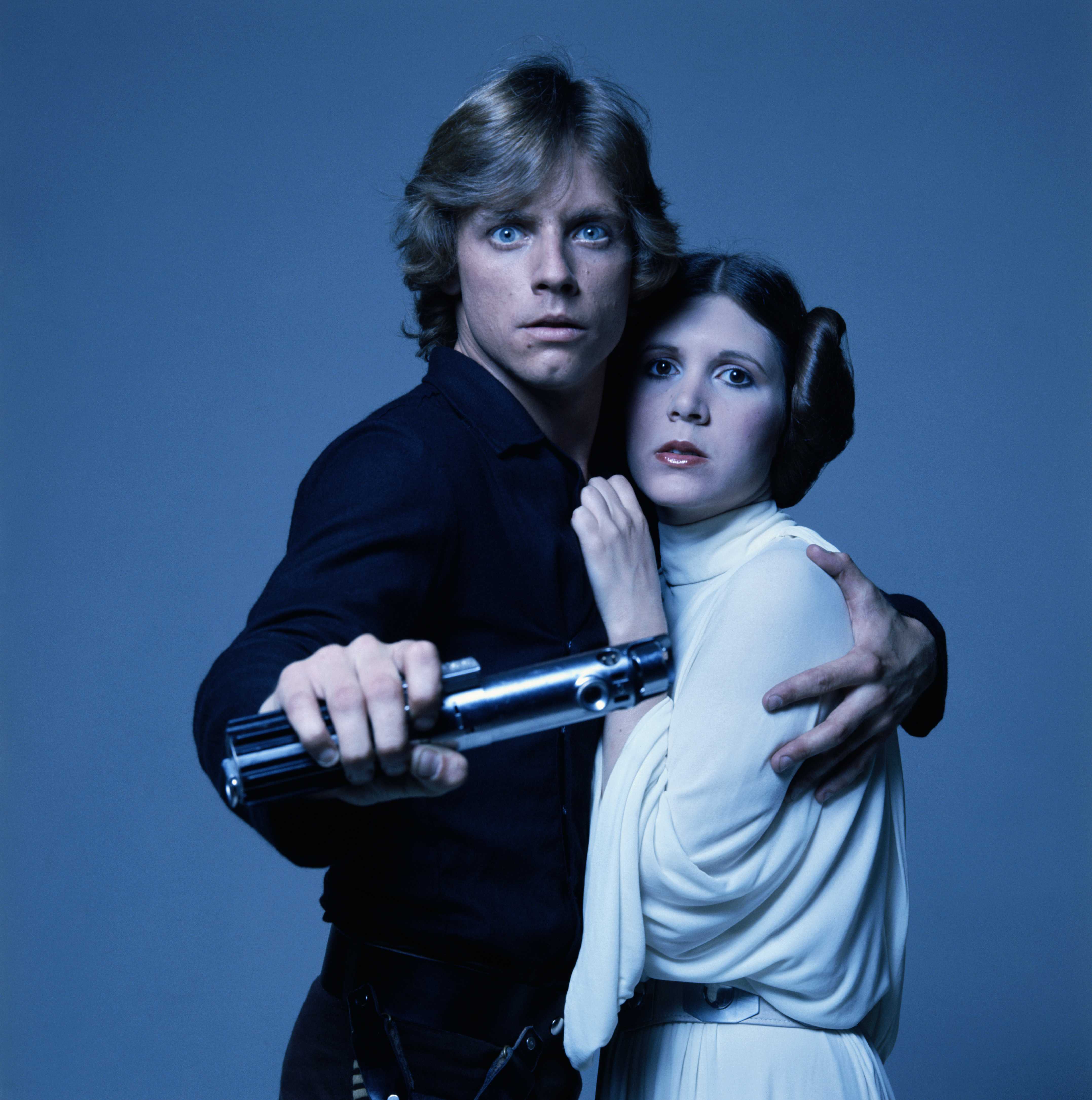 American actors Mark Hamill and Carrie Fisher in costume as brother and sister Luke Skywalker and Princess Leia in George Lucas' Star Wars trilogy, 1977. 