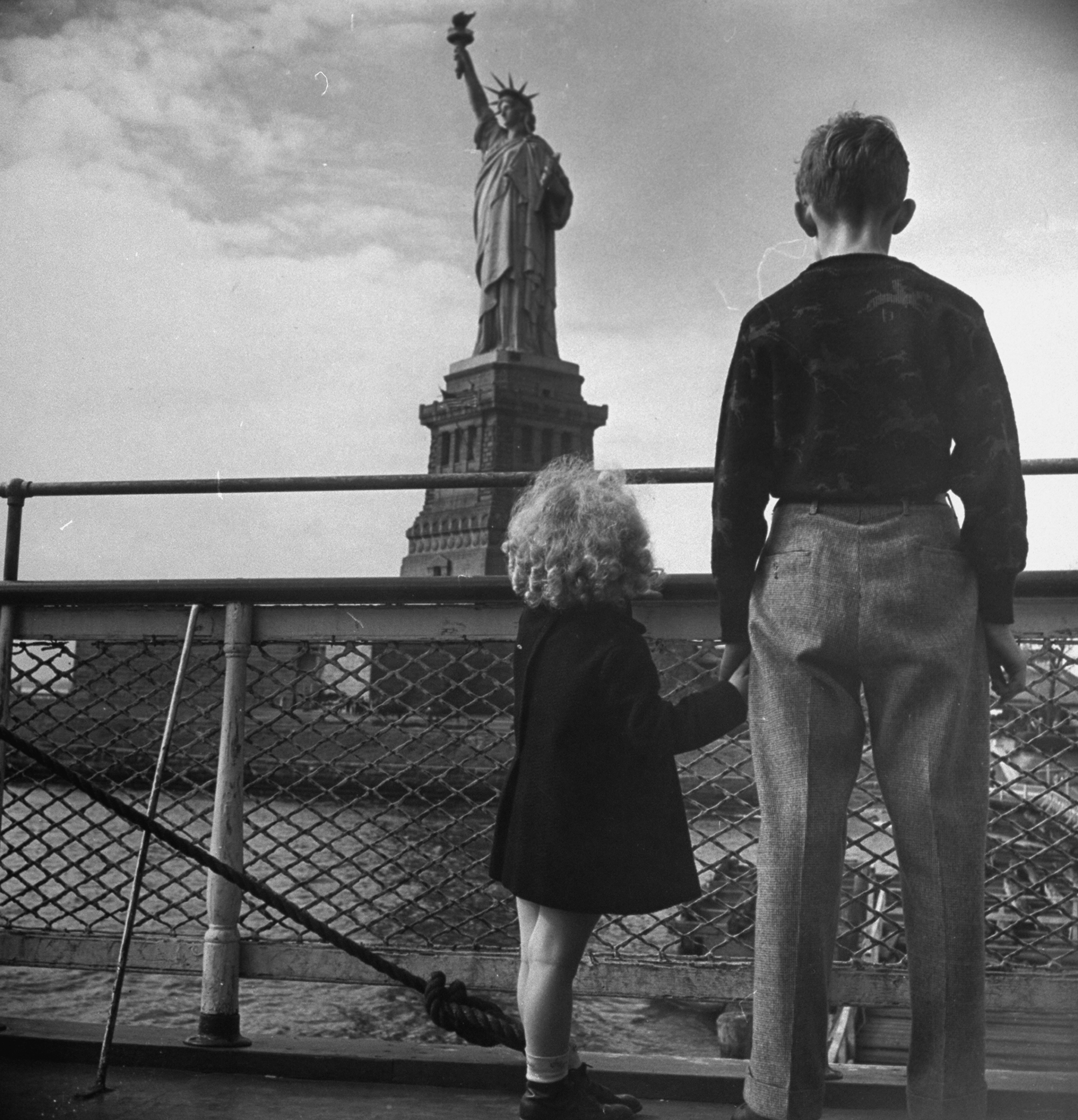 Refugee children gazing at Statue of Lib