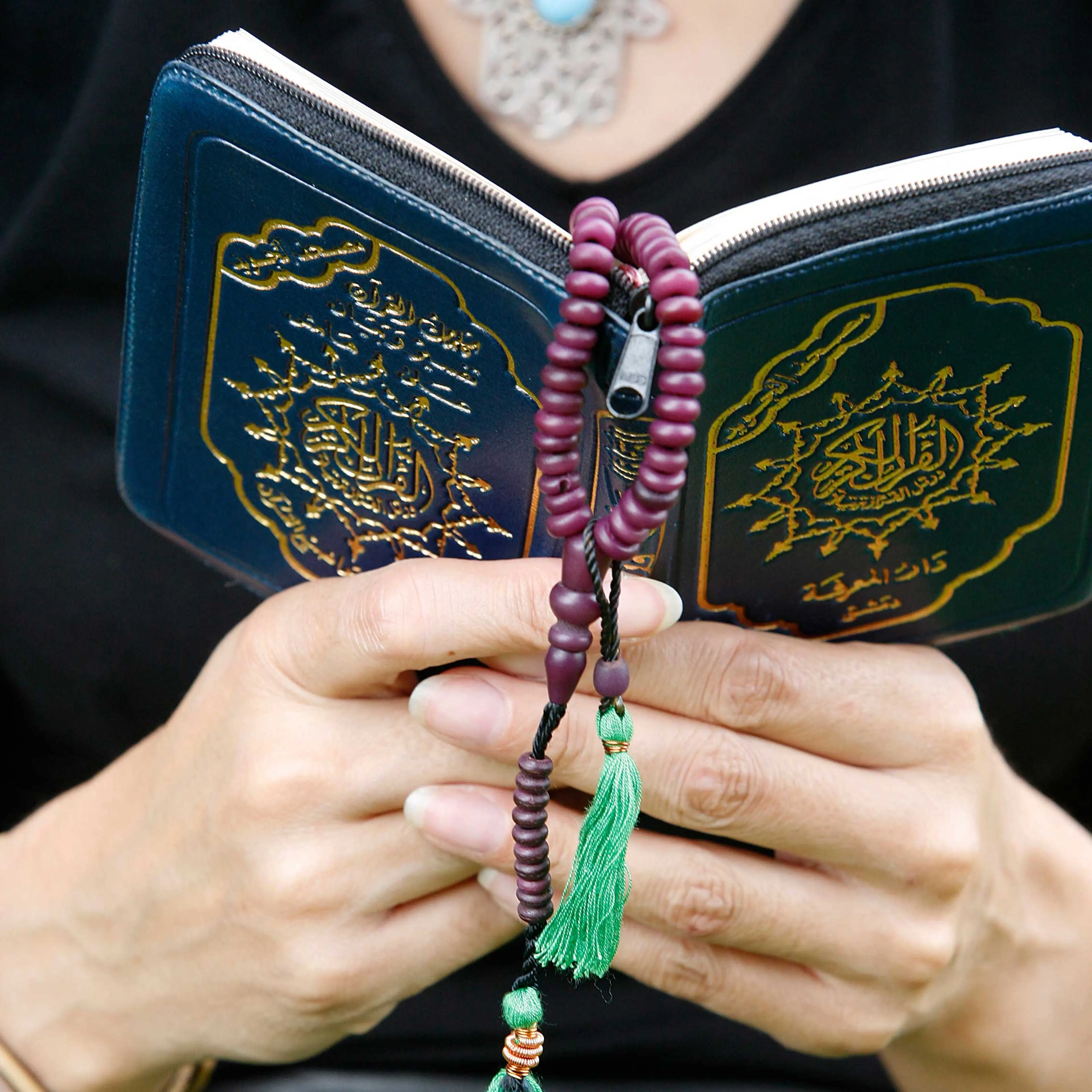 Woman reading the Koran.