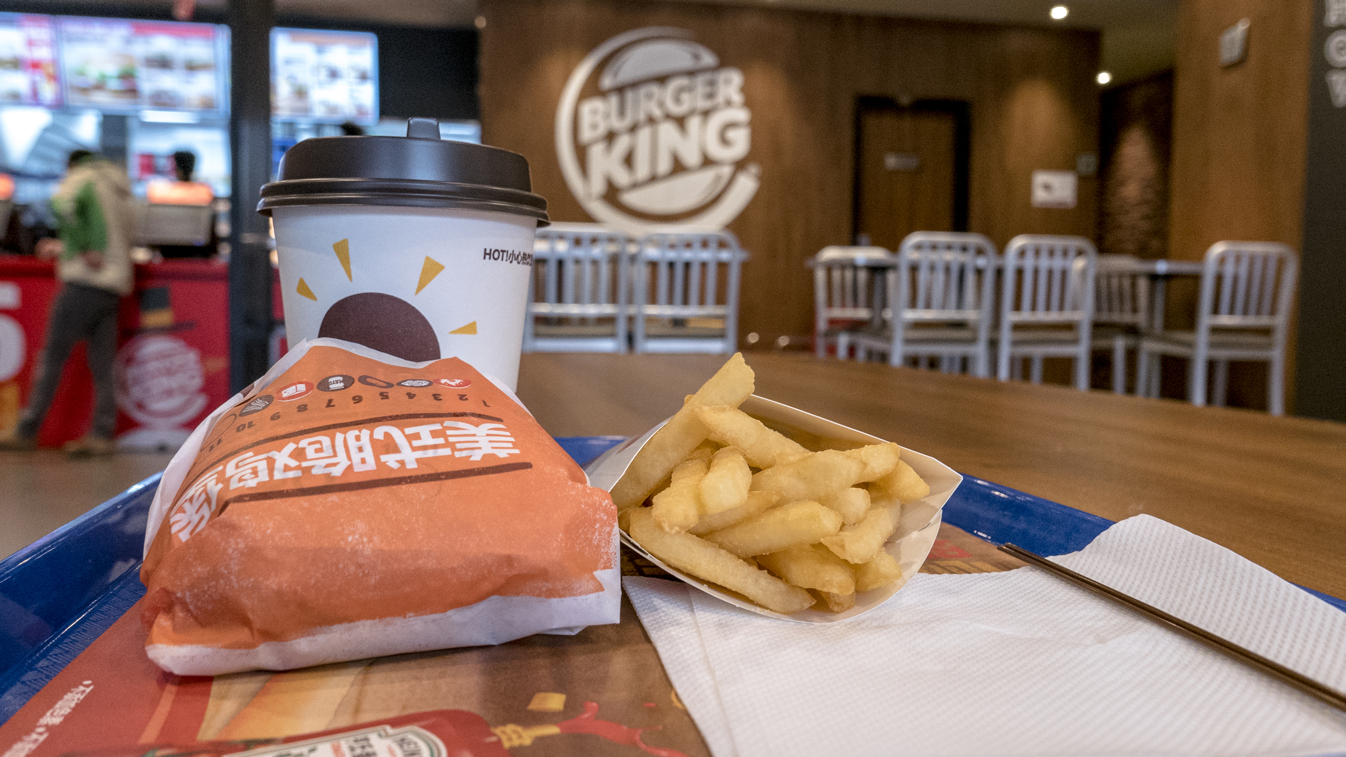 Chinese customers in a Burger King restaurant. Burger King is on the first list of retail ends supporting Apple Pay.