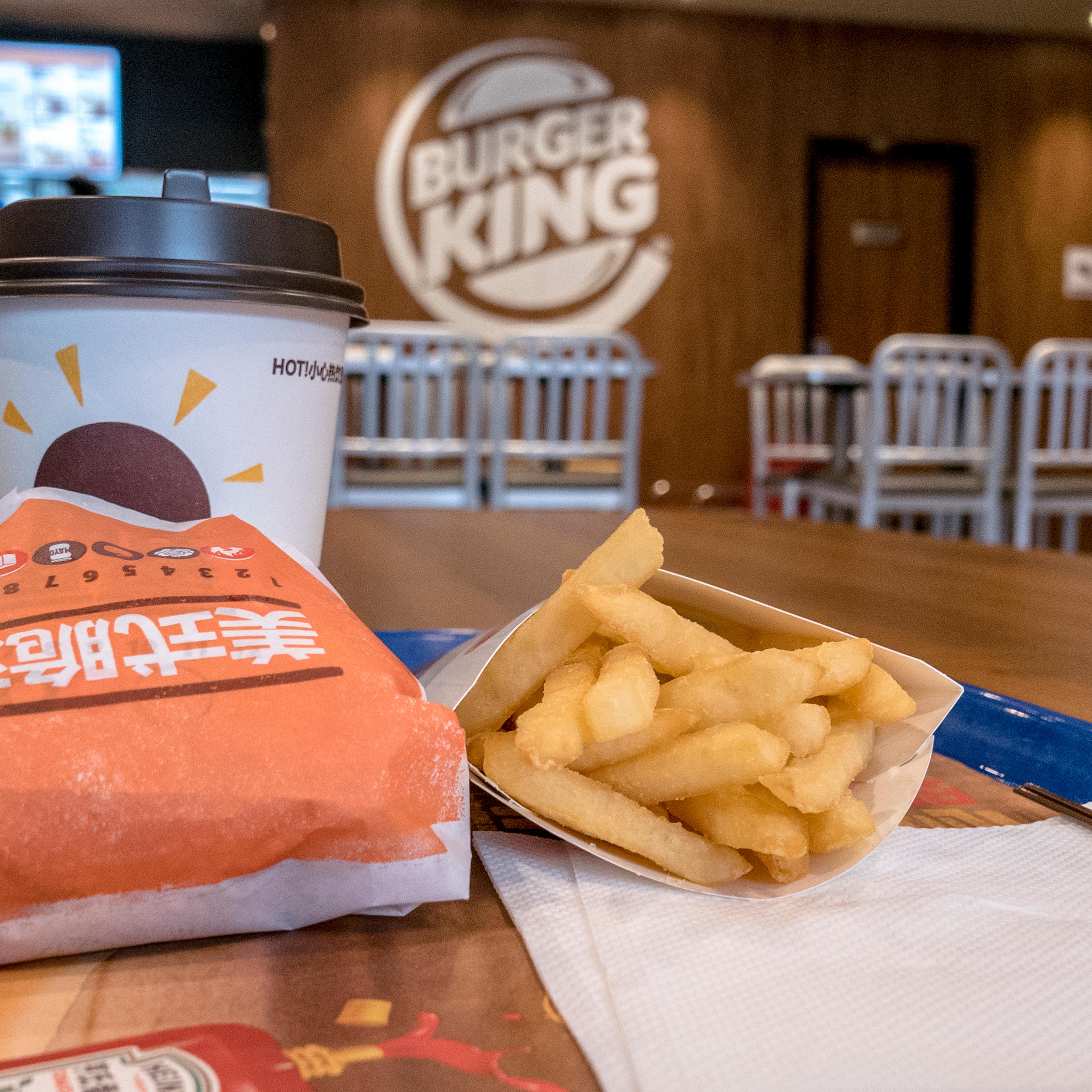 Chinese customers in a Burger King restaurant. Burger King is on the first list of retail ends supporting Apple Pay.