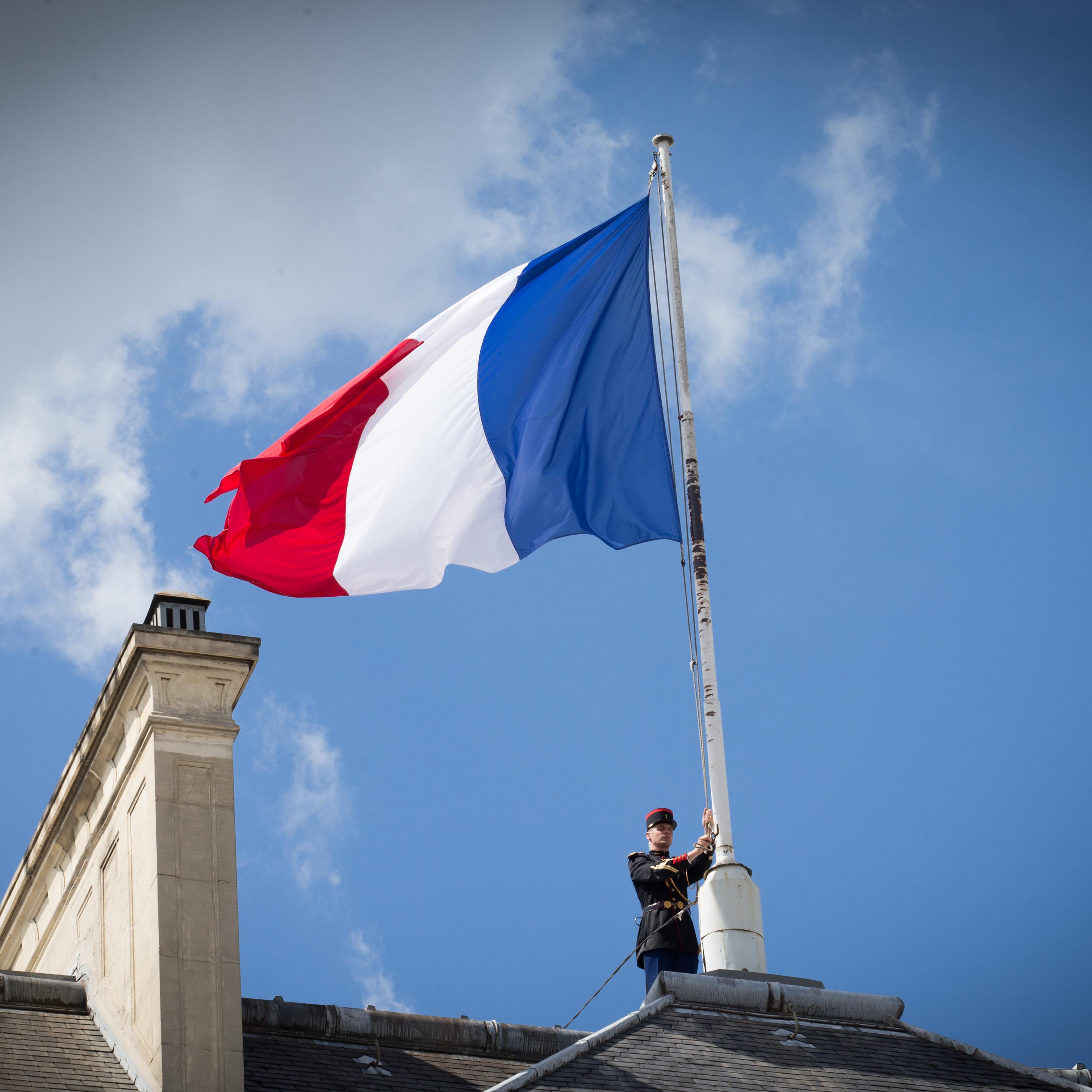 The French flag is at half mast after a Security and Defense Council, chaired by French President Francois Hollande at the Elysee Palace on July 15, 2016 in Paris, France.