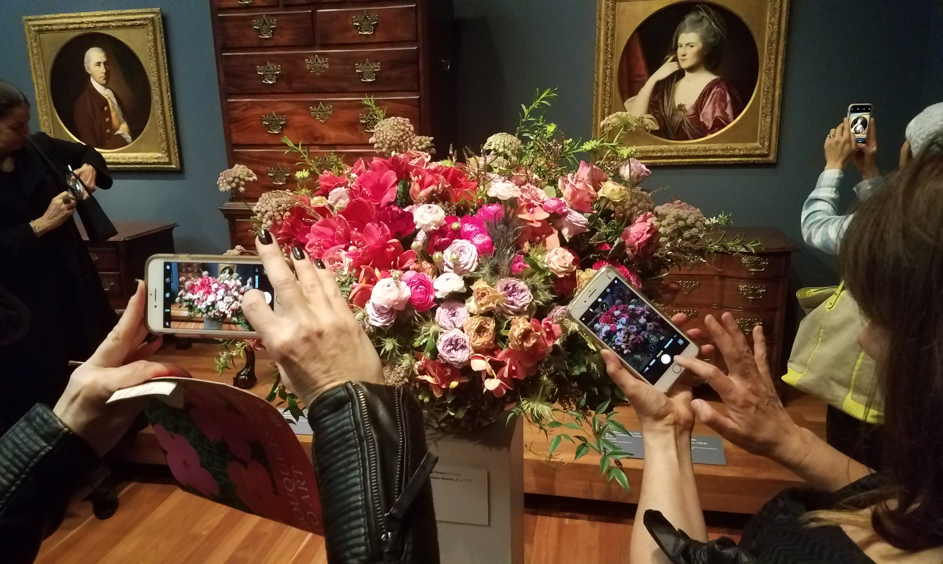 Museum goers take photos at the Bouquets to Art exhibit at the de Young Museum in San Francisco on Wednesday, March 14, 2018. 