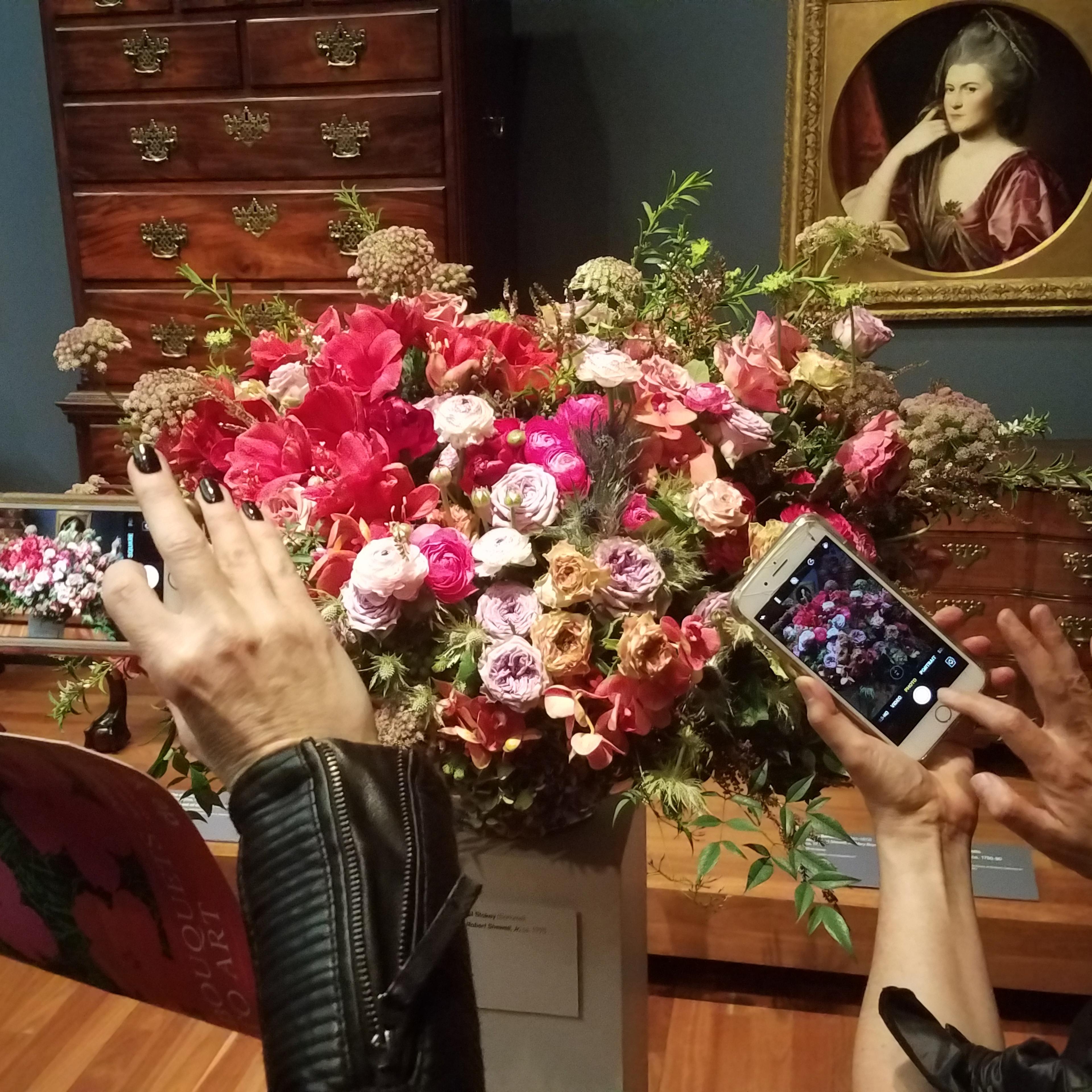 Museum goers take photos at the Bouquets to Art exhibit at the de Young Museum in San Francisco on Wednesday, March 14, 2018.