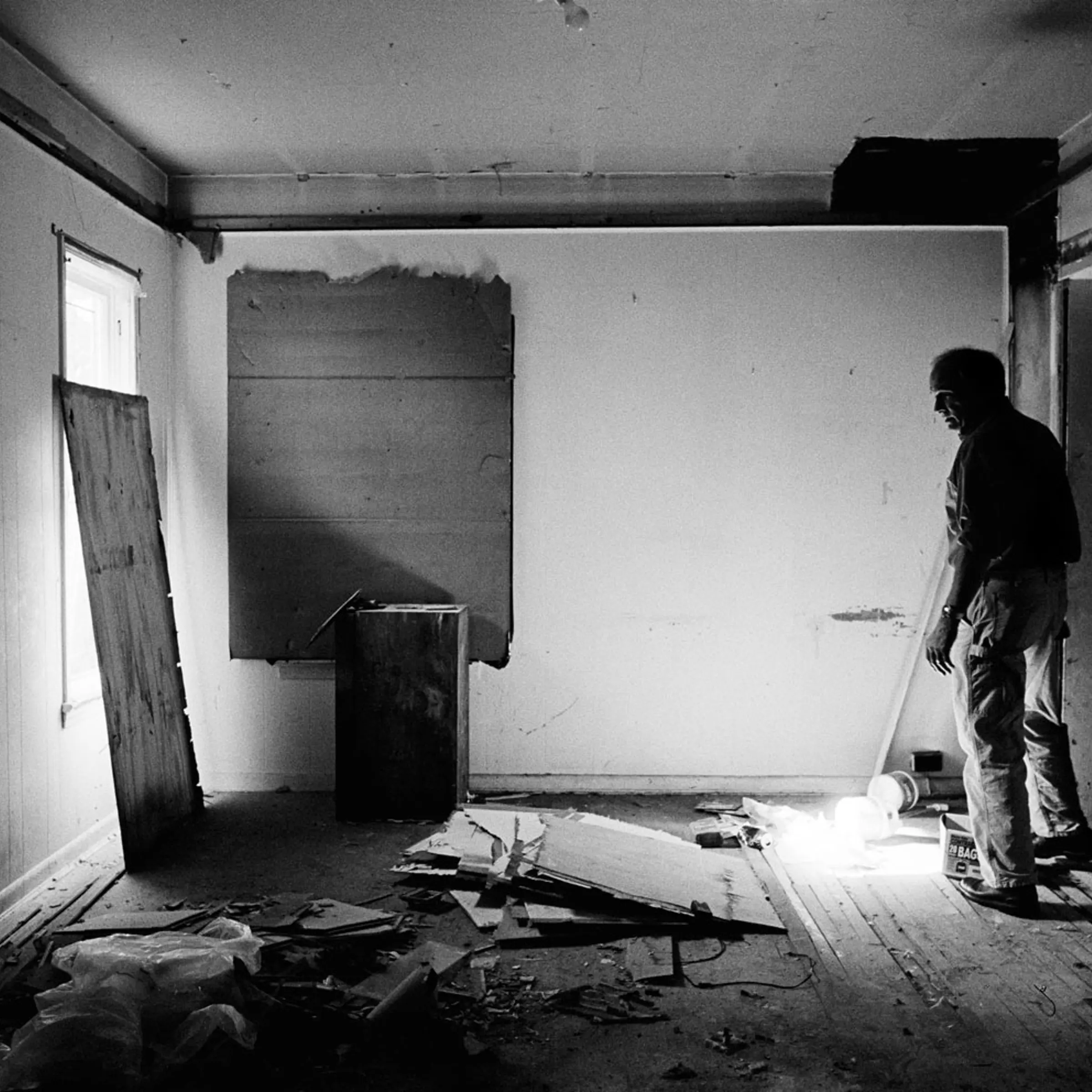 Fred Ford of Neighborhood Progress inspects an empty home in Cleveland in July 2010.